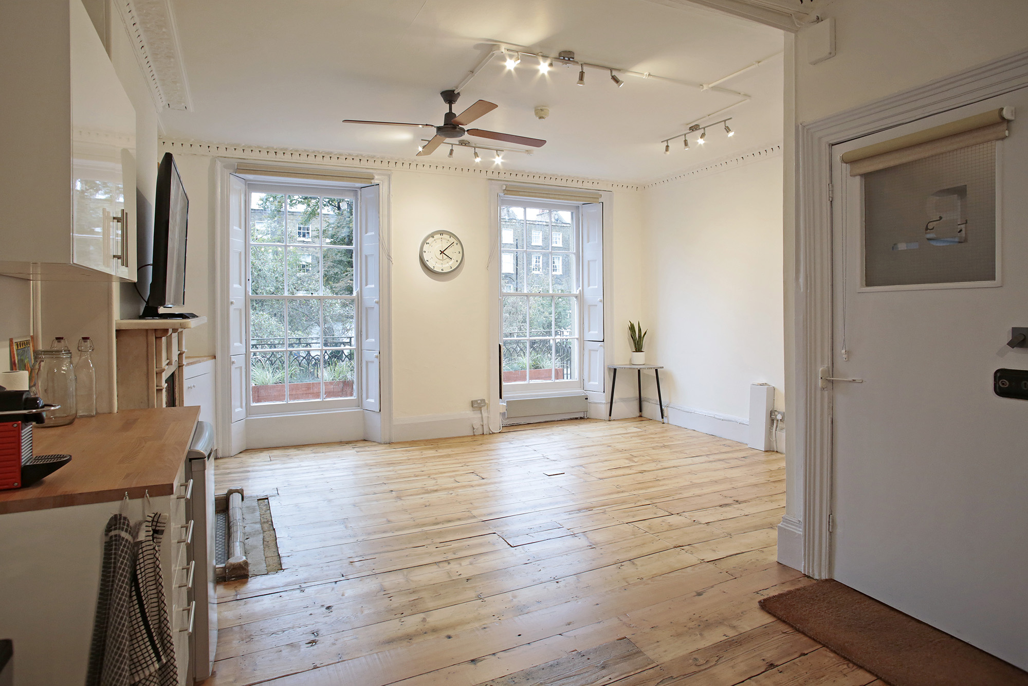 Versatile venue with natural light, ideal for intimate meetings and small events.