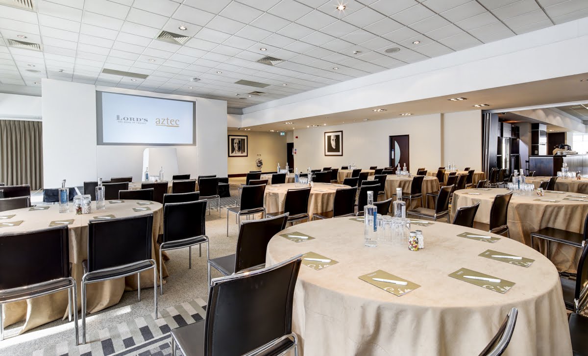 Thomas Lord Suite ballroom with cabaret seating for corporate meetings and workshops.