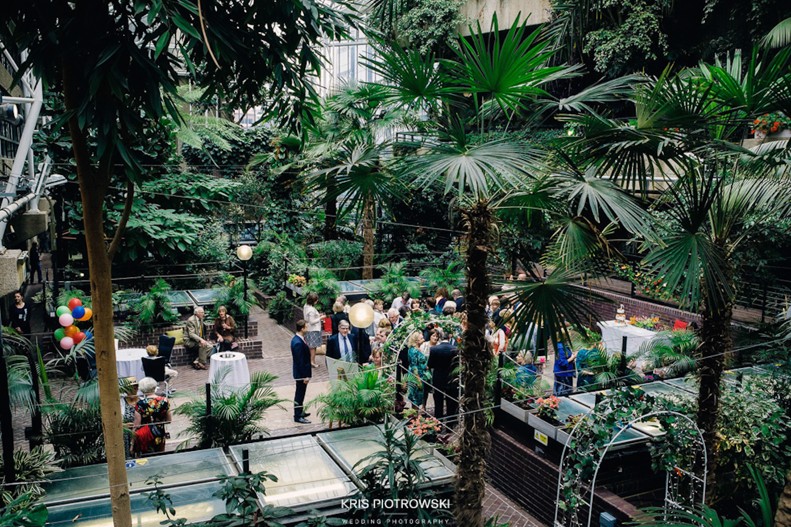 Vibrant Barbican Conservatory with lush greenery for networking and celebratory events.