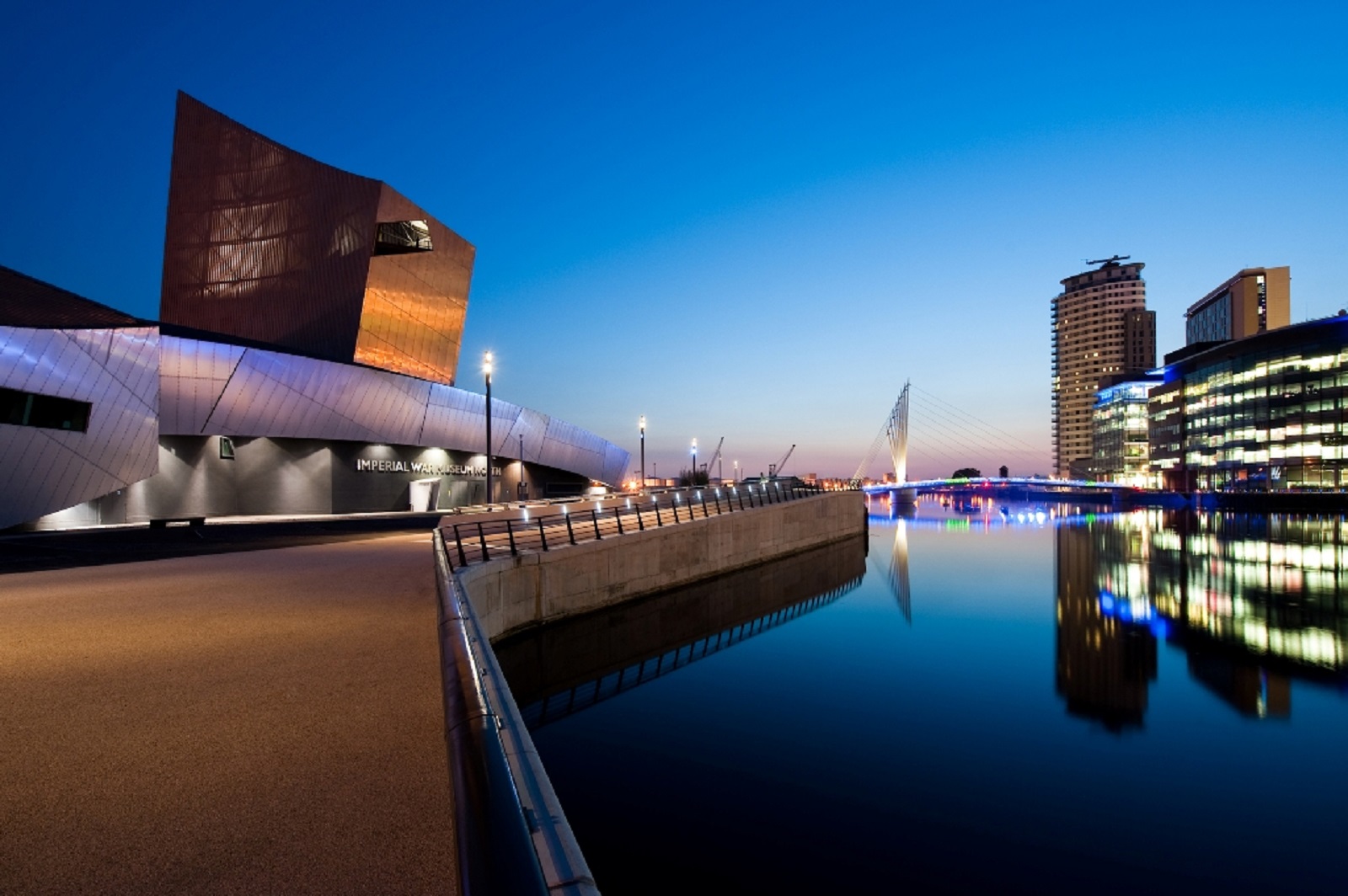 "Exclusive Hire venue at Imperial War Museum North, modern architecture by waterfront for events."