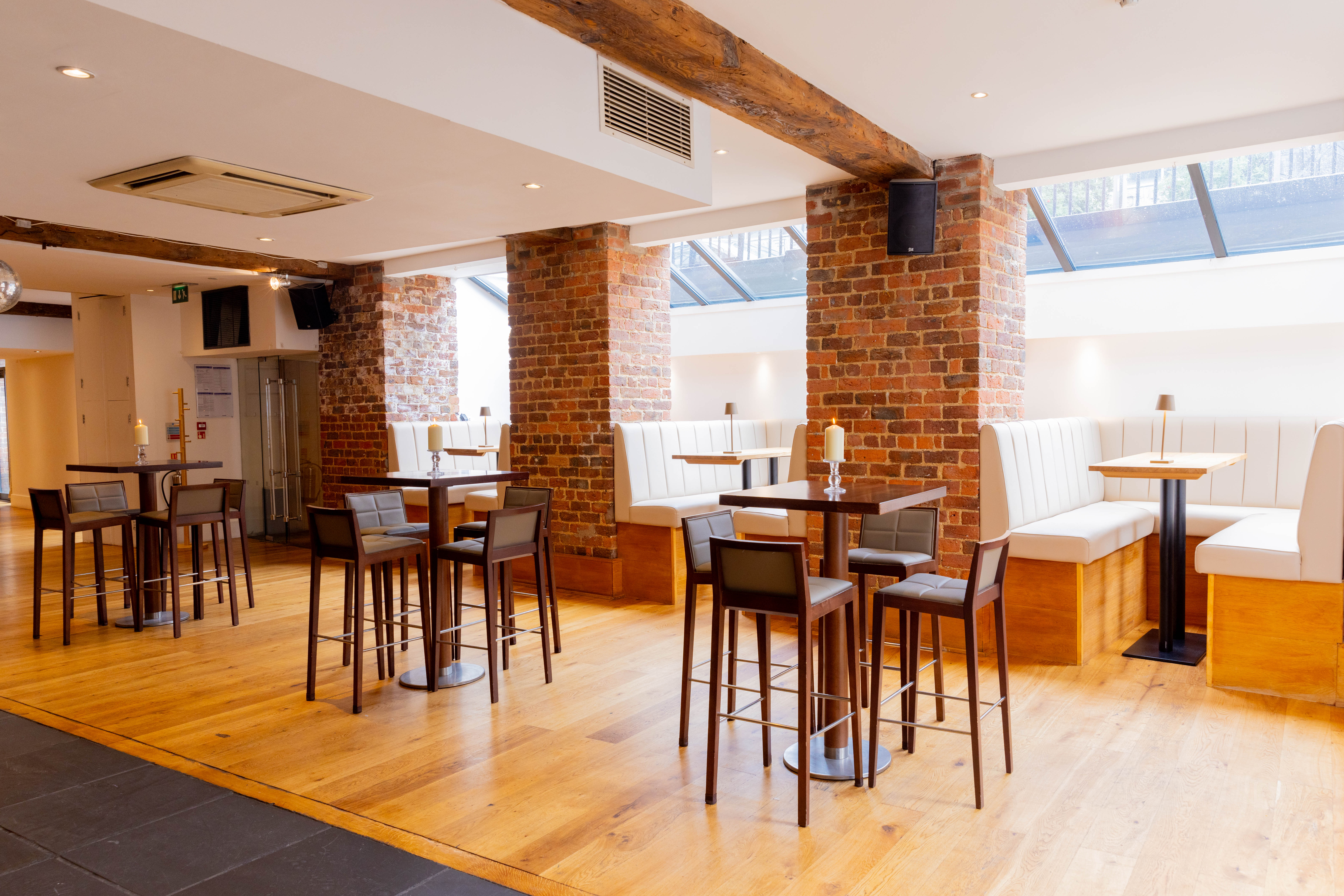 Modern event space with wooden floors and natural light at Hope Street Hotel.