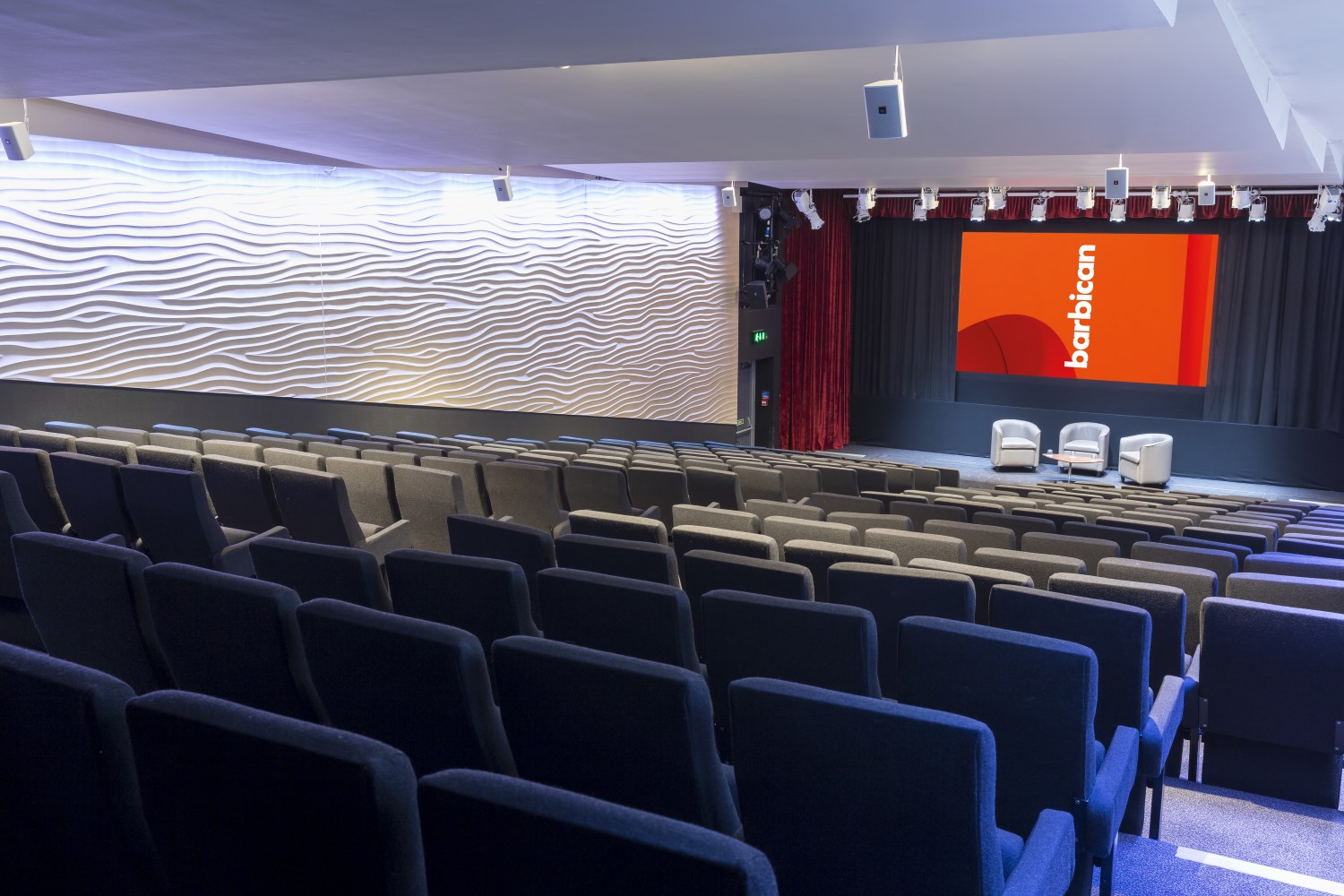 Frobisher Auditorium 1: modern event space with tiered seating for corporate conferences.