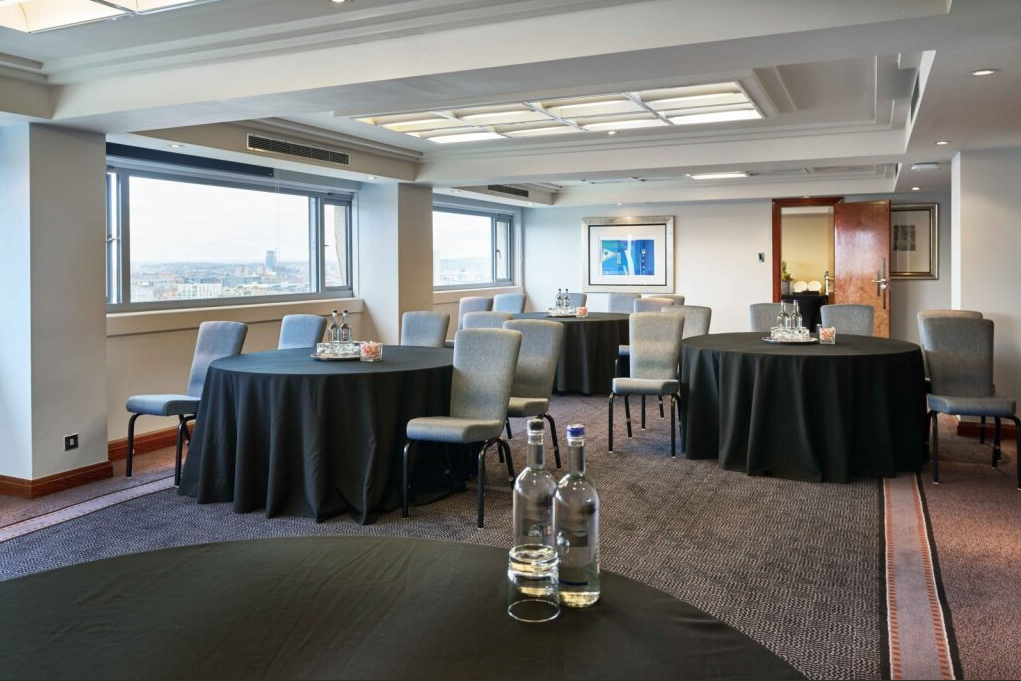Britannia Suite London event space, round tables, natural light, cocktail reception