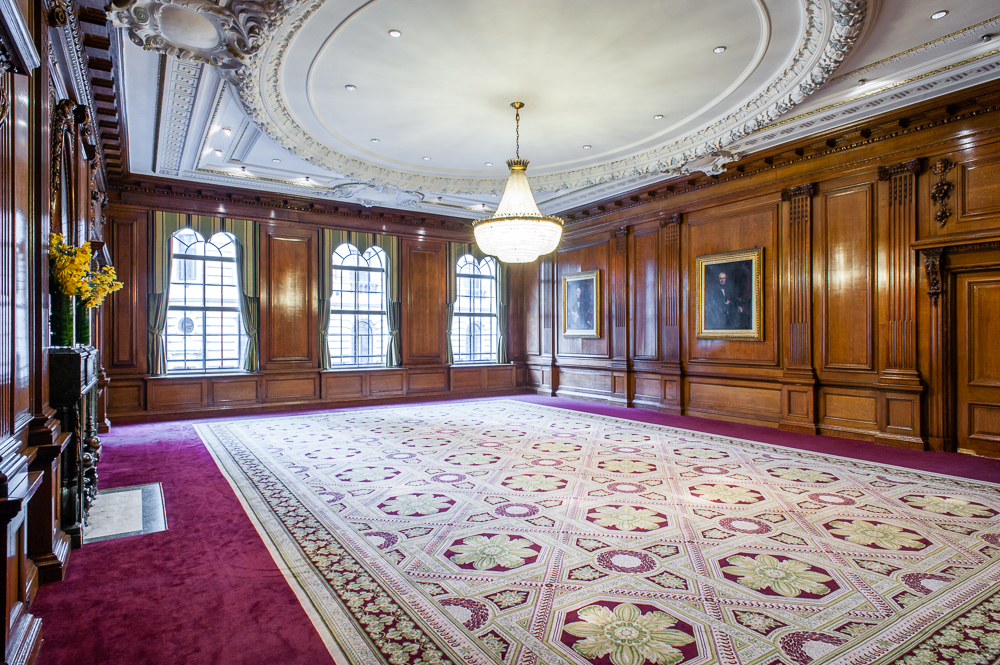 Elegant Council Room with wood paneling, ideal for meetings and upscale events.