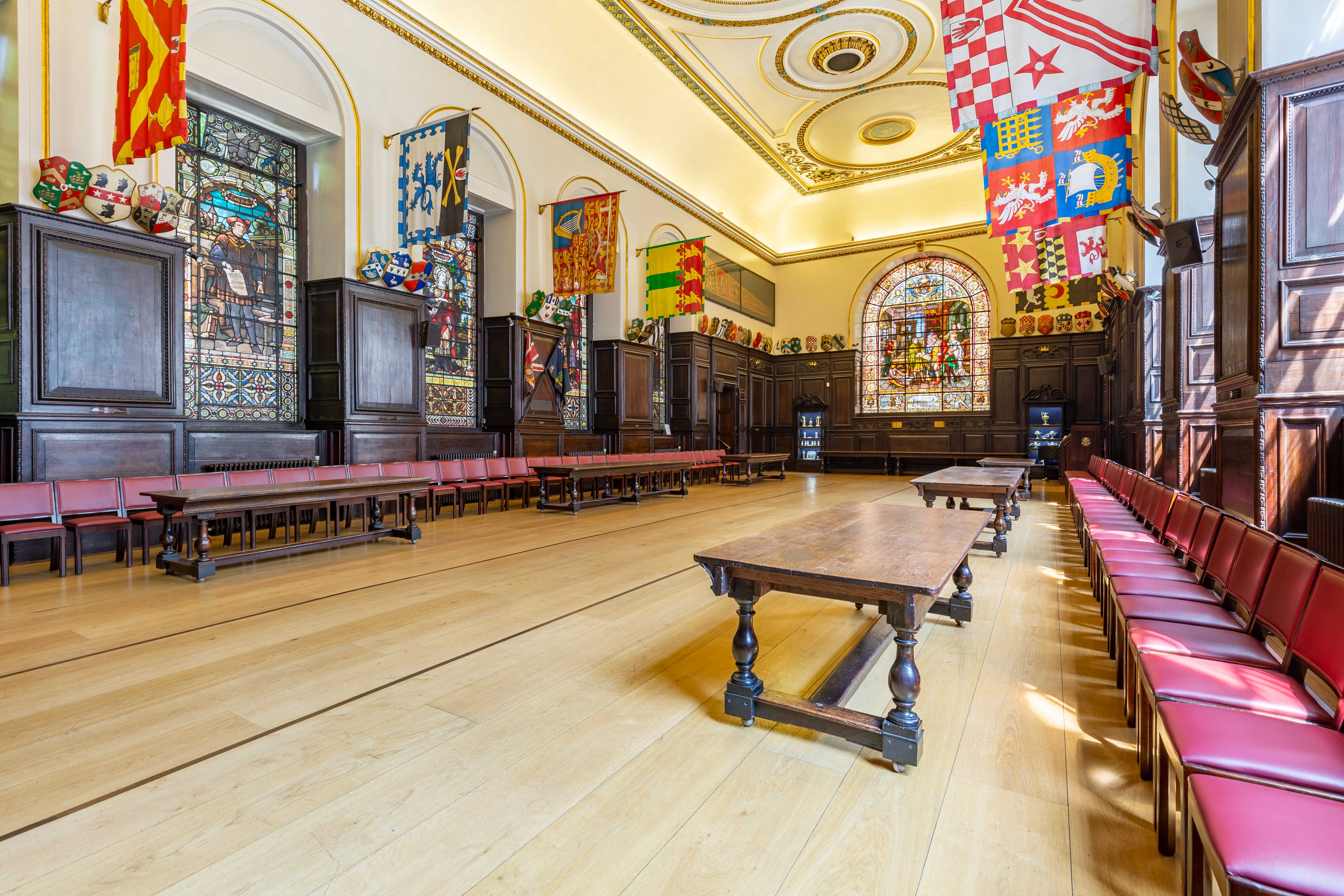Elegant meeting room with wooden paneling at Stationers' Hall for conferences and banquets.