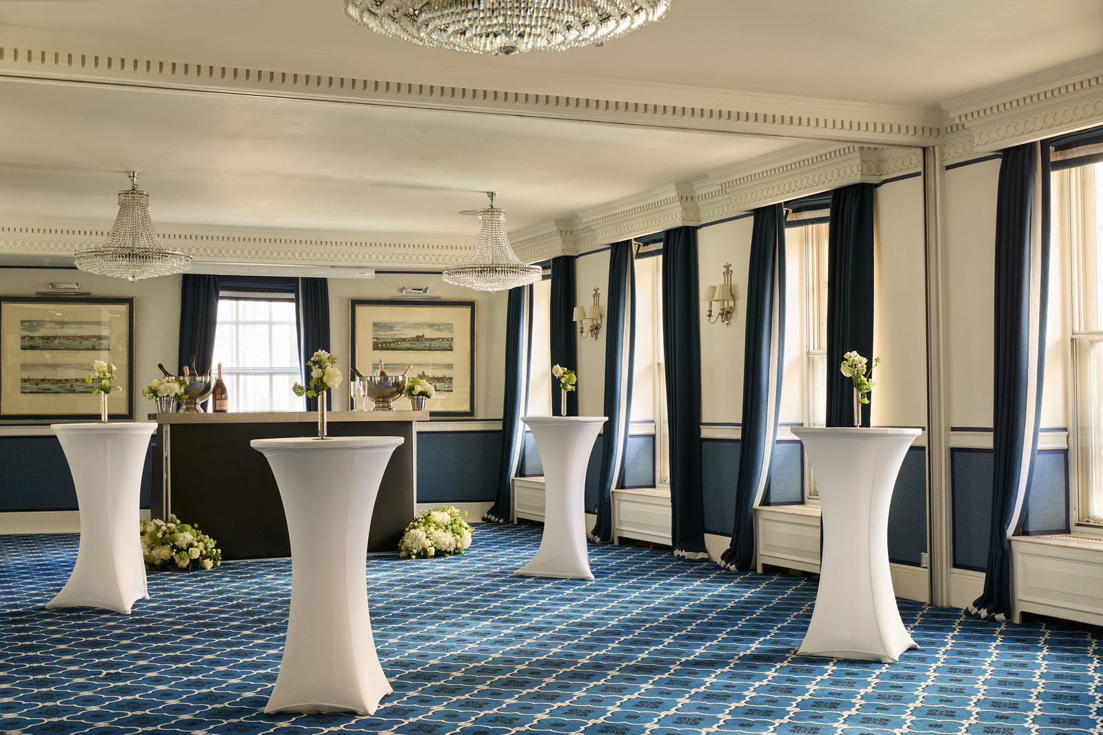 Elegant Charles Suite reception with cocktail tables for networking and corporate events.