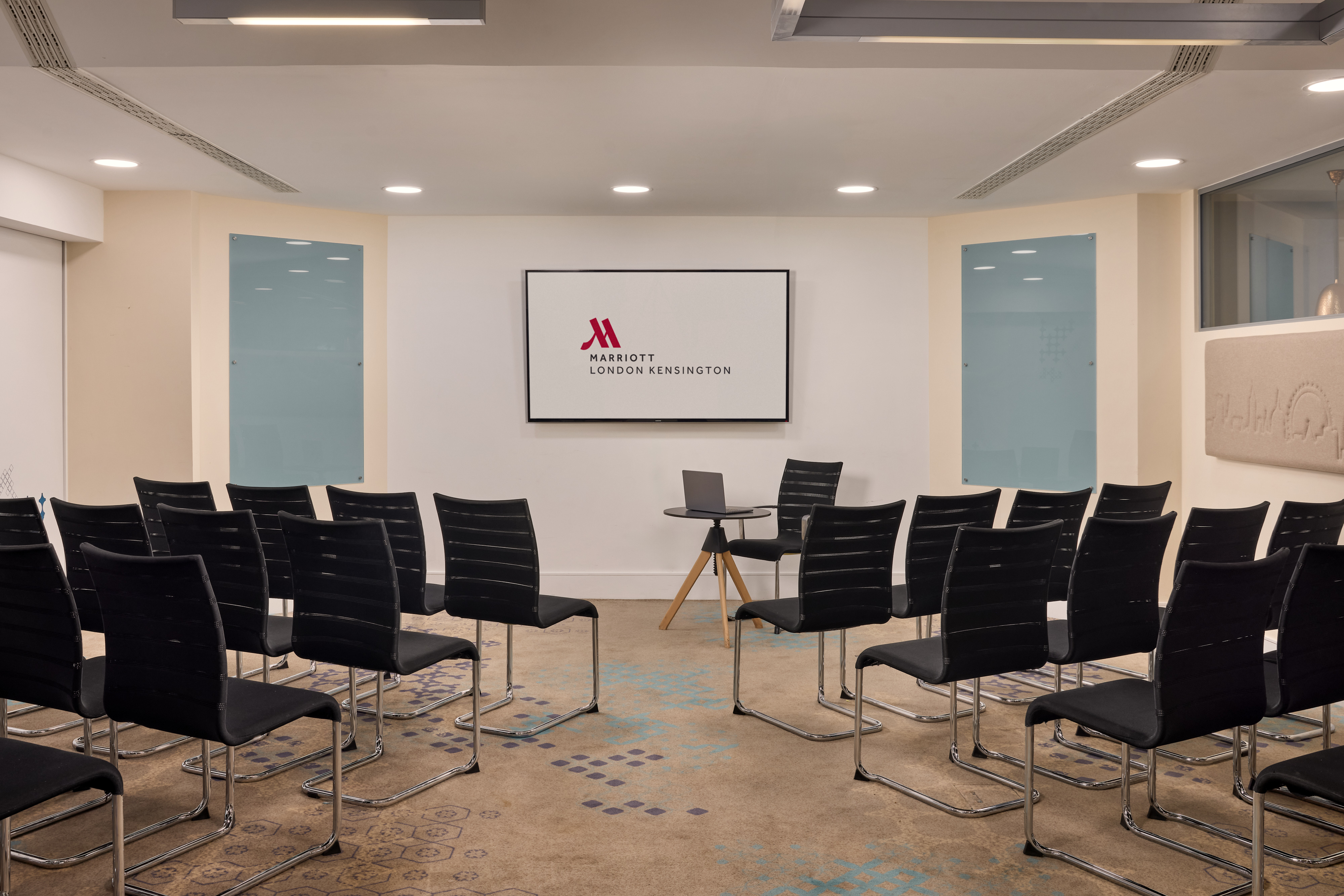 Theater-style meeting room at London Marriott Hotel Kensington for corporate training events.
