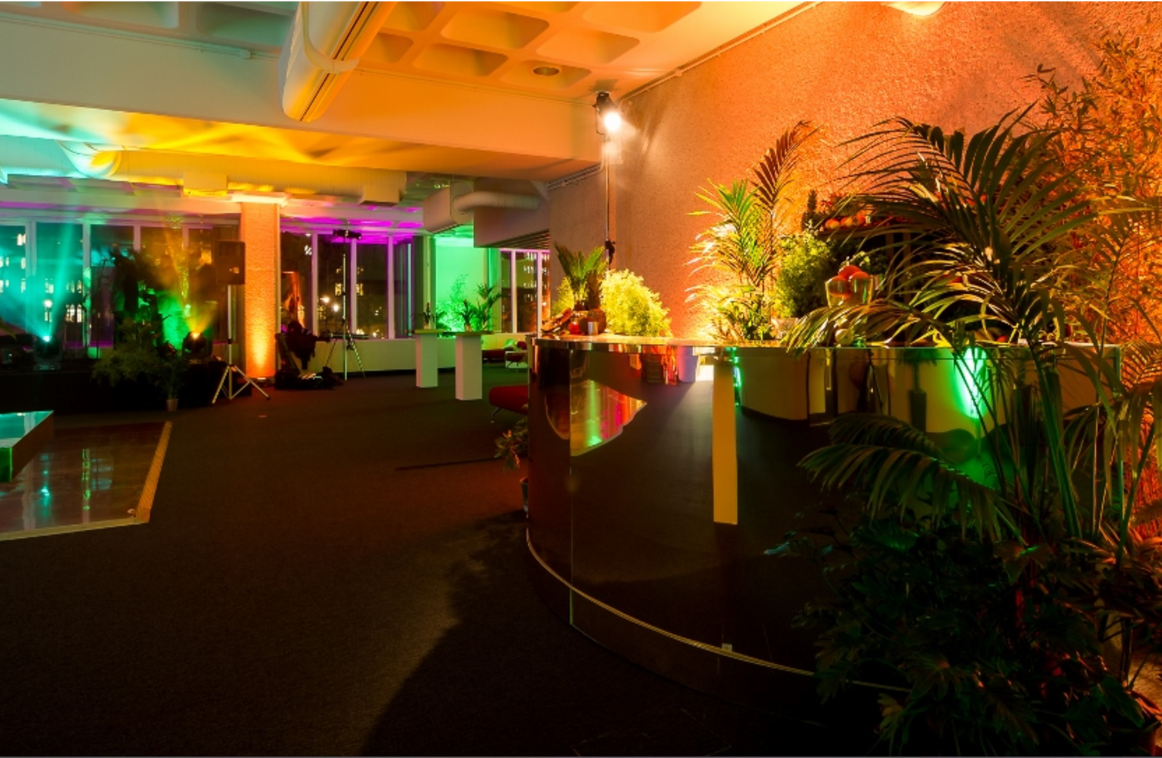 Pickwick event space at QEII Centre with vibrant lighting, ideal for corporate networking events.