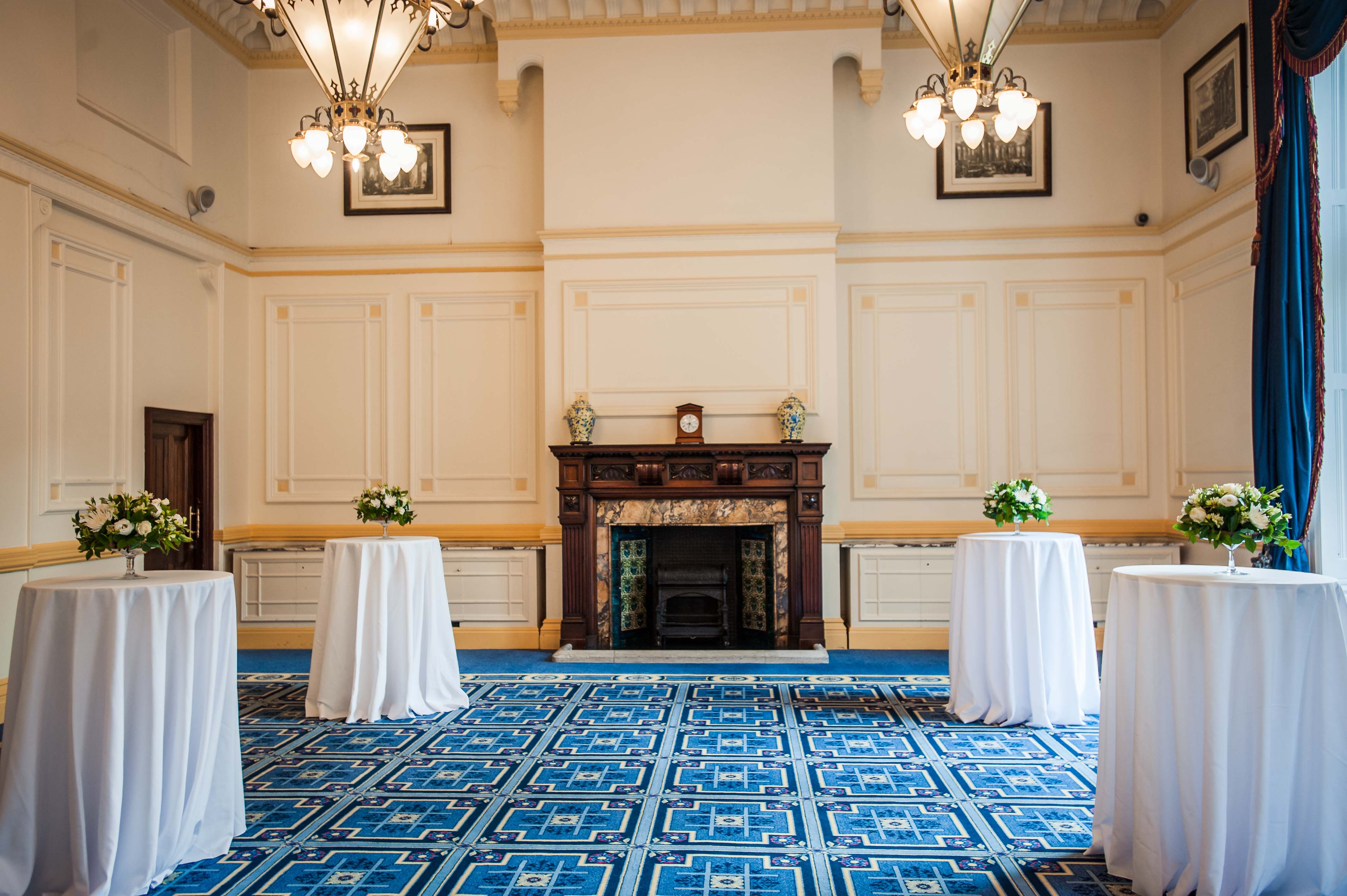 Elegant Meston Suite with floral tables, perfect for networking events and receptions.