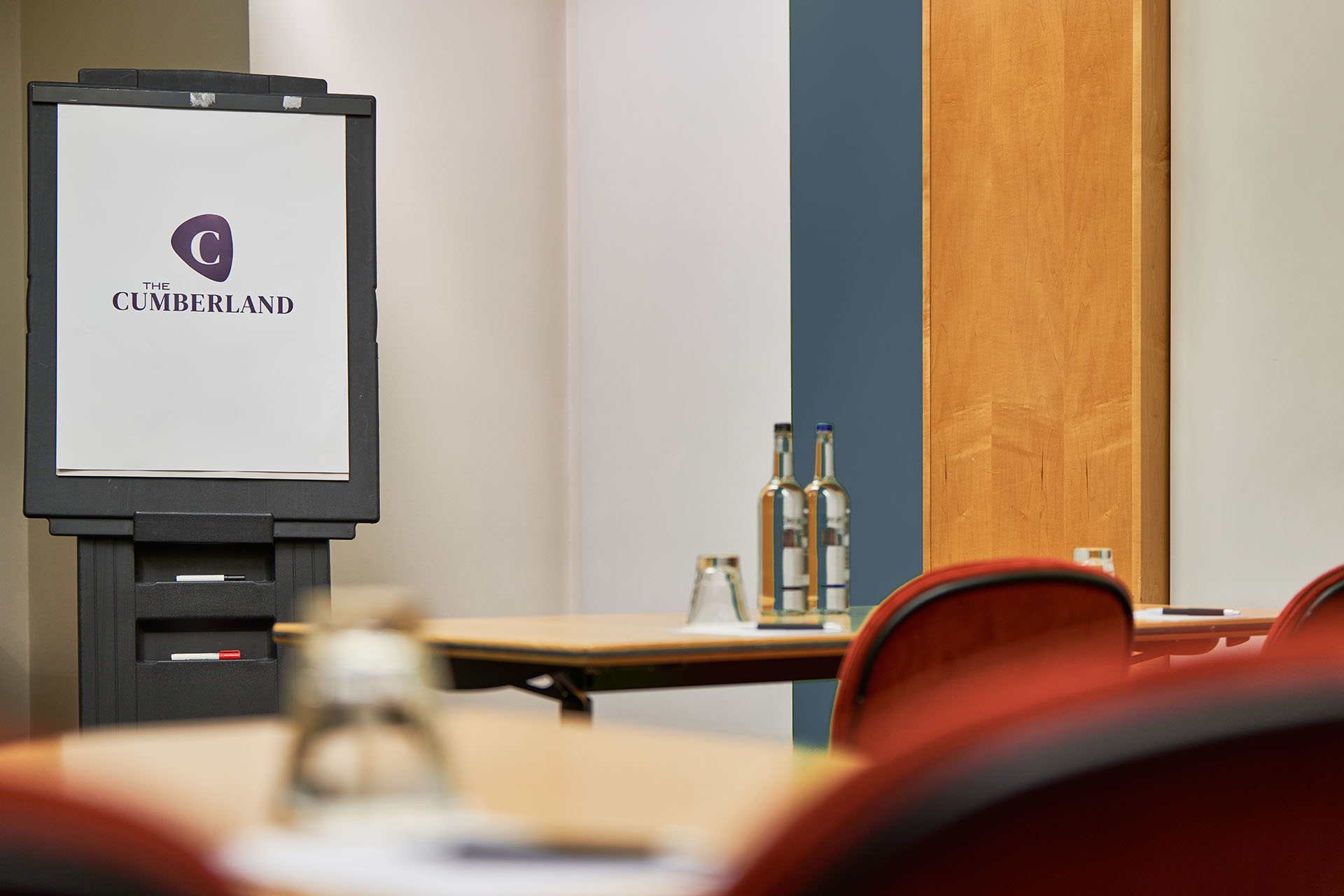 Meeting space in Studio 8, Cumberland Hotel, with branded flip chart for workshops.