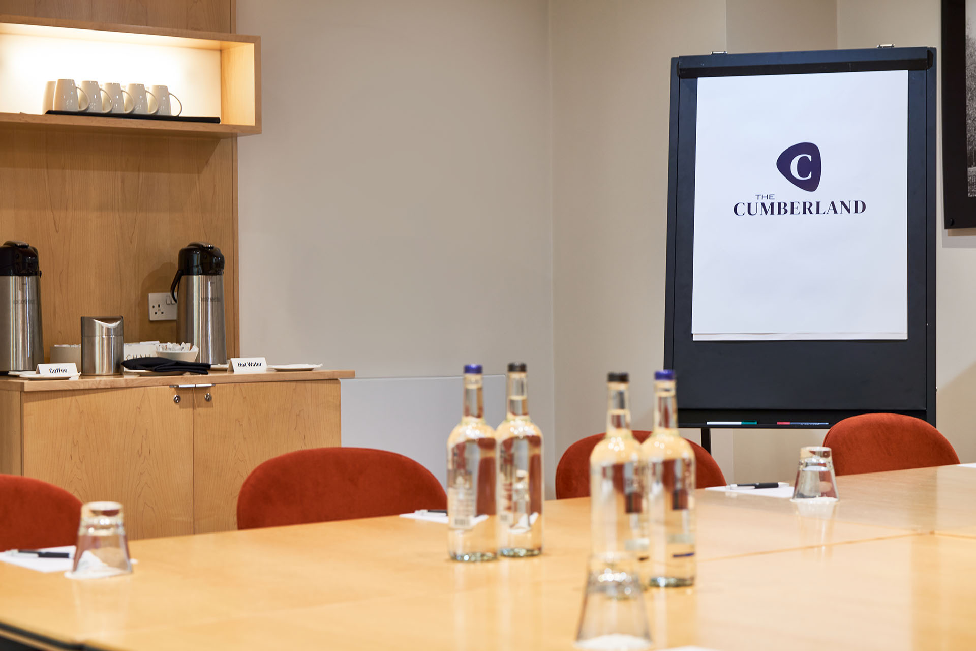 Meeting room at The Cumberland Hotel with polished table, ideal for professional events.