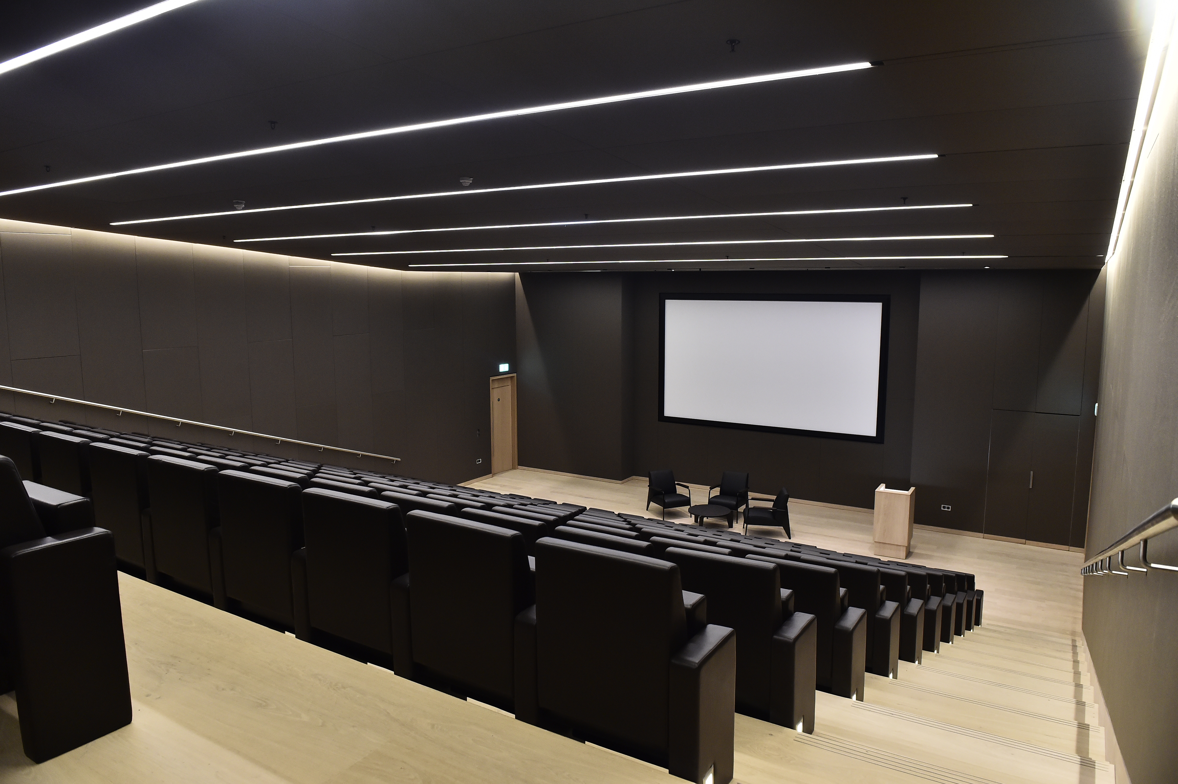 Modern Bakala Auditorium with tiered seating for corporate presentations and panel discussions.