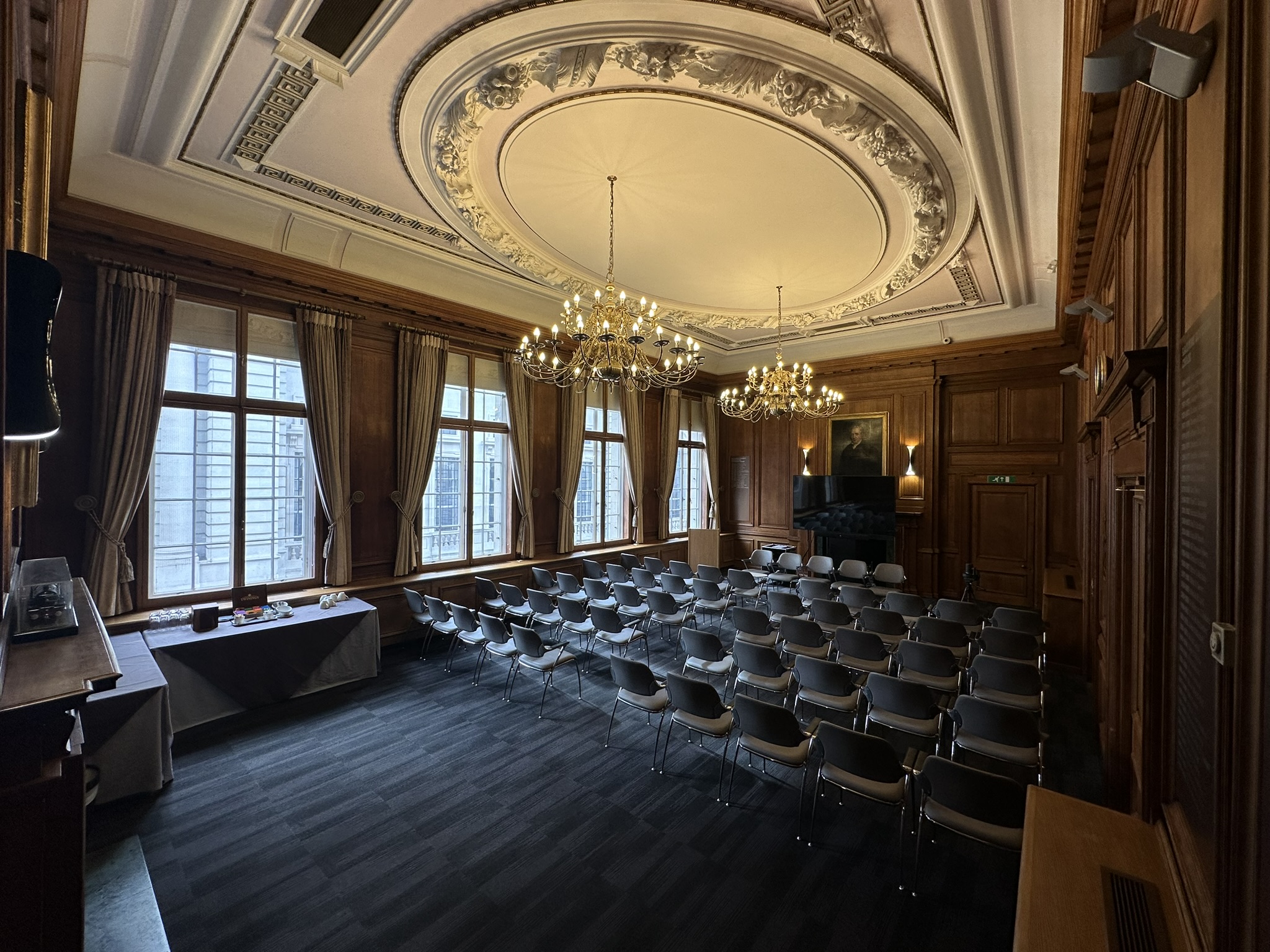 Boardroom meeting, wood paneling, executive presentation, conference