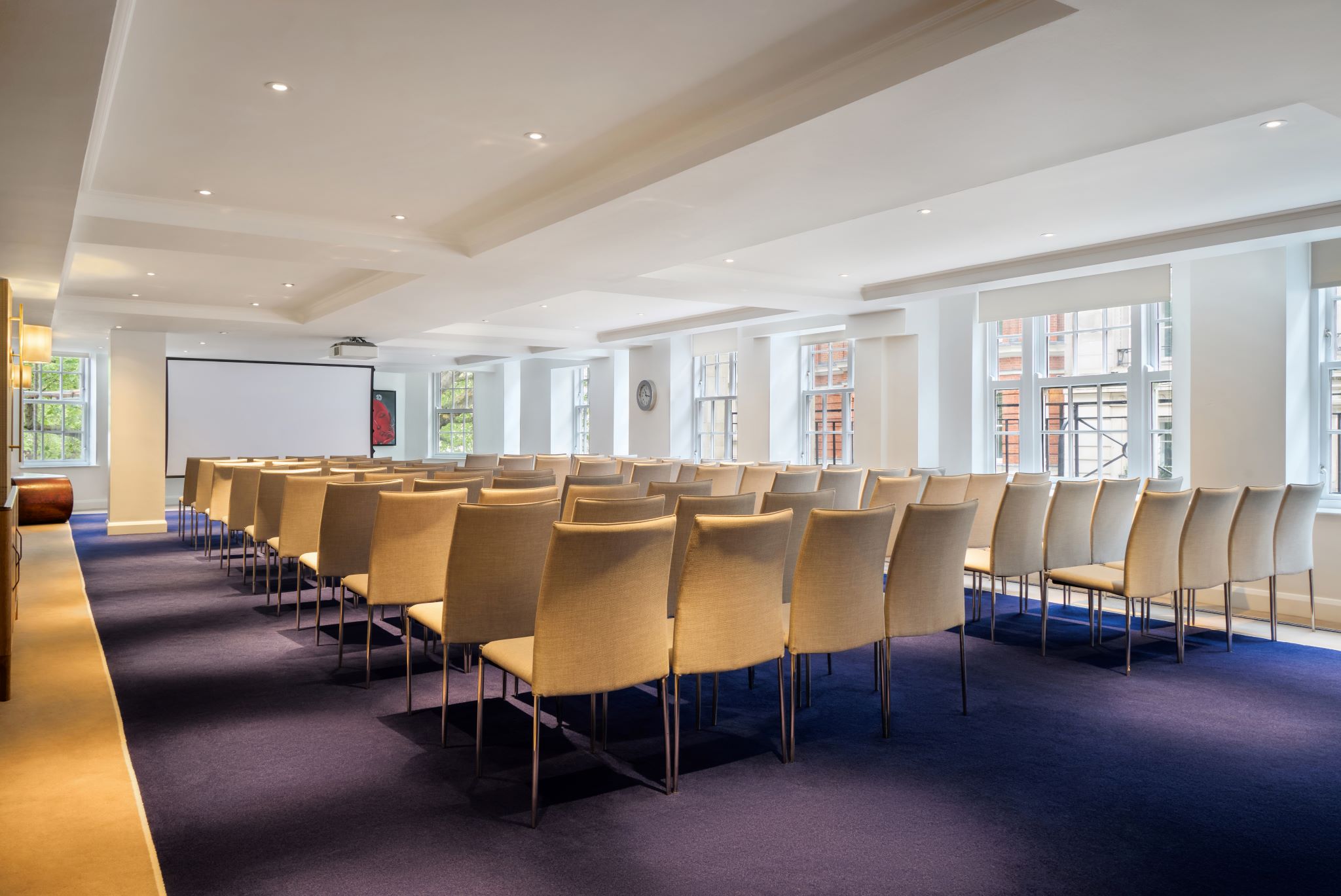 Theater-style meeting room setup in The May Fair Hotel for corporate events and presentations.