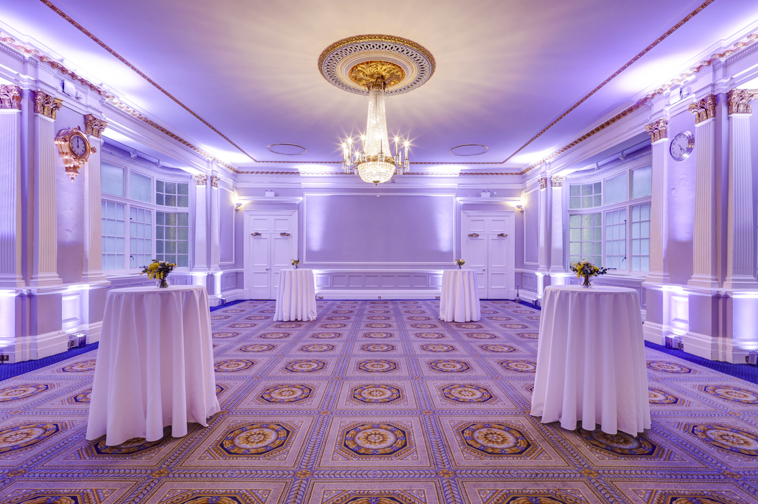 Elegant event space at Burton, 116 Pall Mall, featuring soft purple lighting and luxury ambiance.