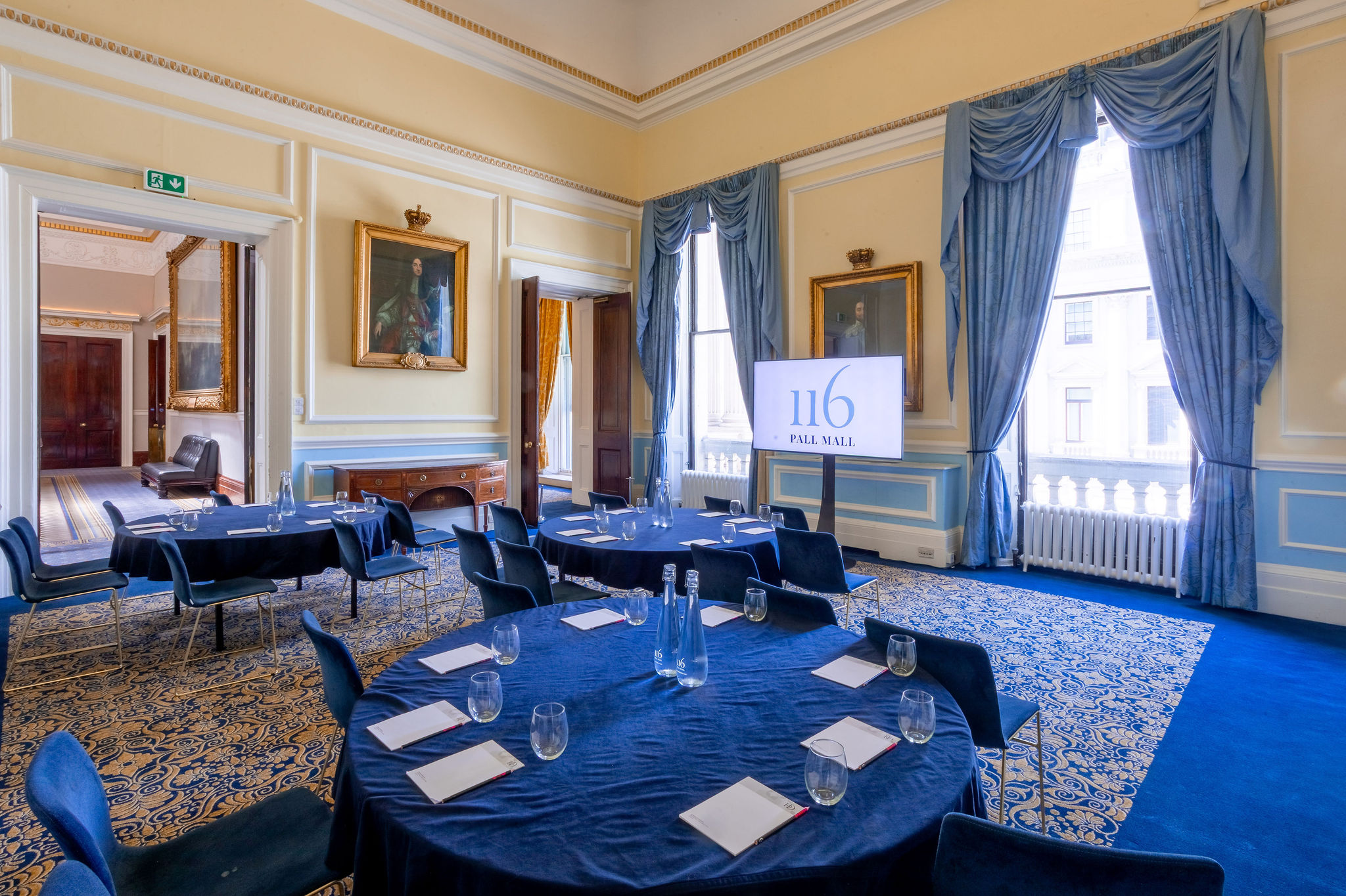 St James Rooms at 116 Pall Mall with blue-linen setup for corporate board meetings.