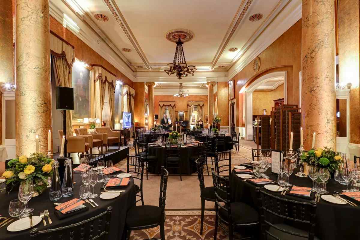 Carlton Room gala setup, elegant florals, stage