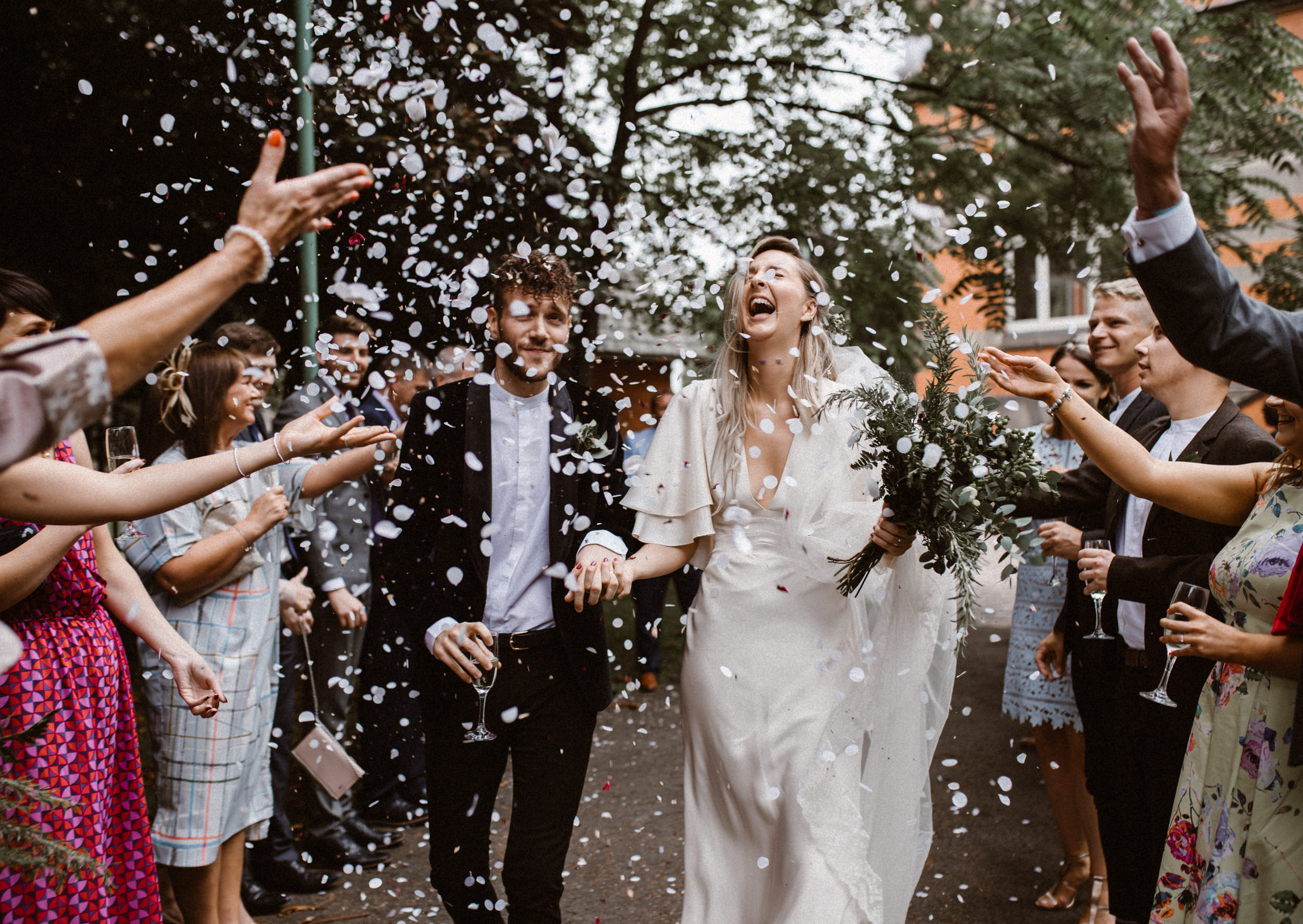 Joyful wedding celebration at The Pumping House with confetti and elegant decor. - Banner
