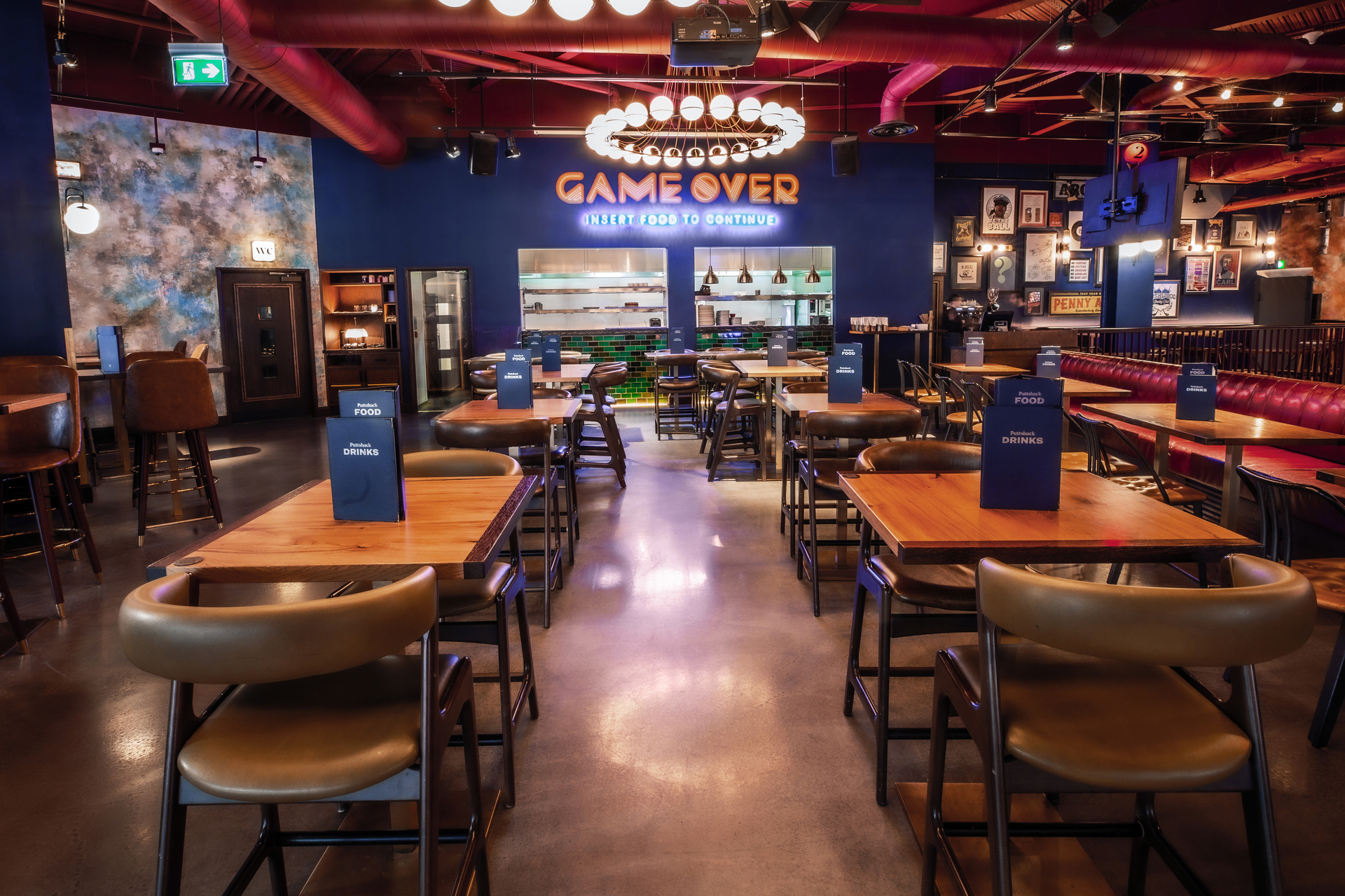 Vibrant event space at Puttshack White City for team-building and social gatherings.
