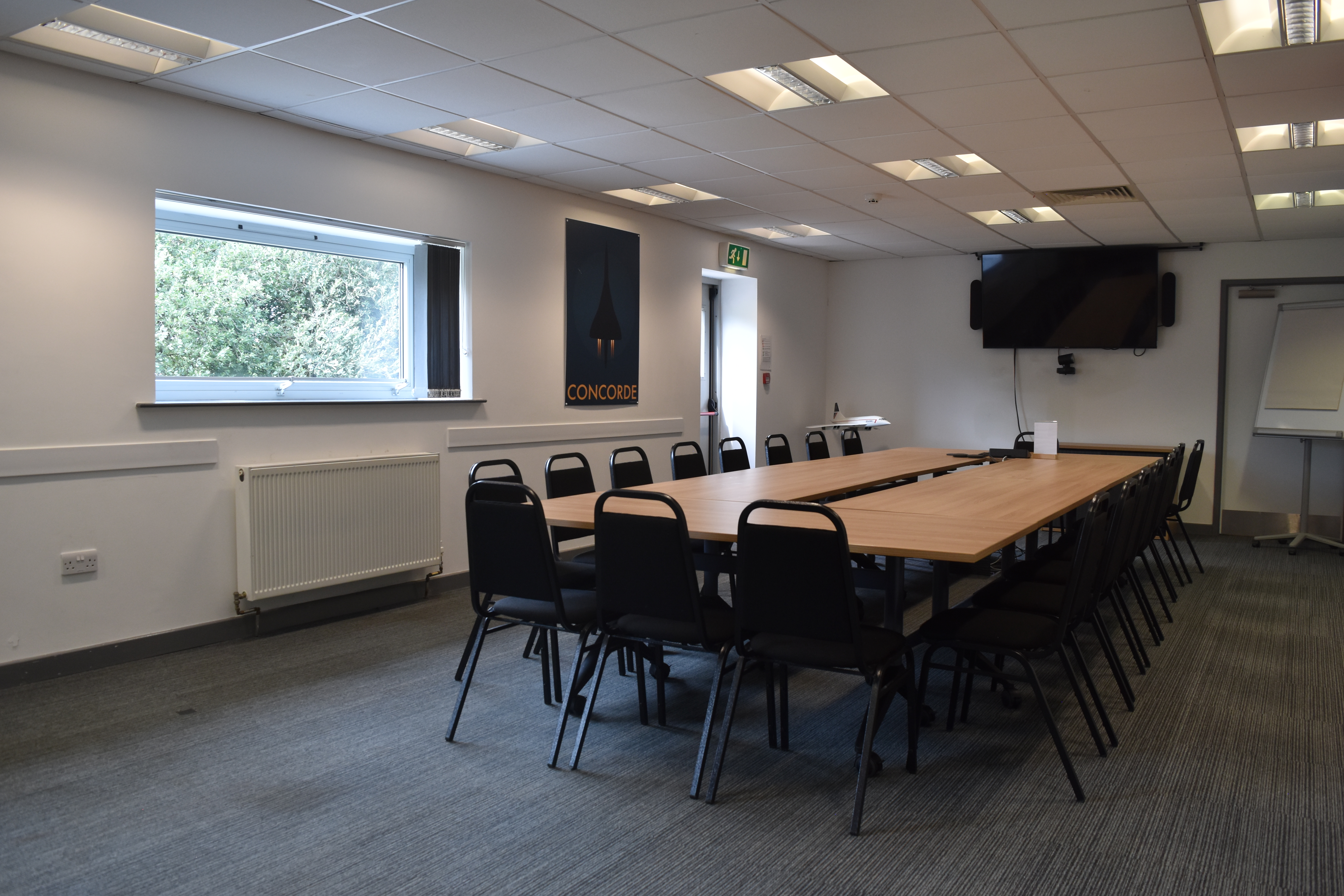 Alpha Charlie Suite meeting room with long table, ideal for workshops and strategy sessions.