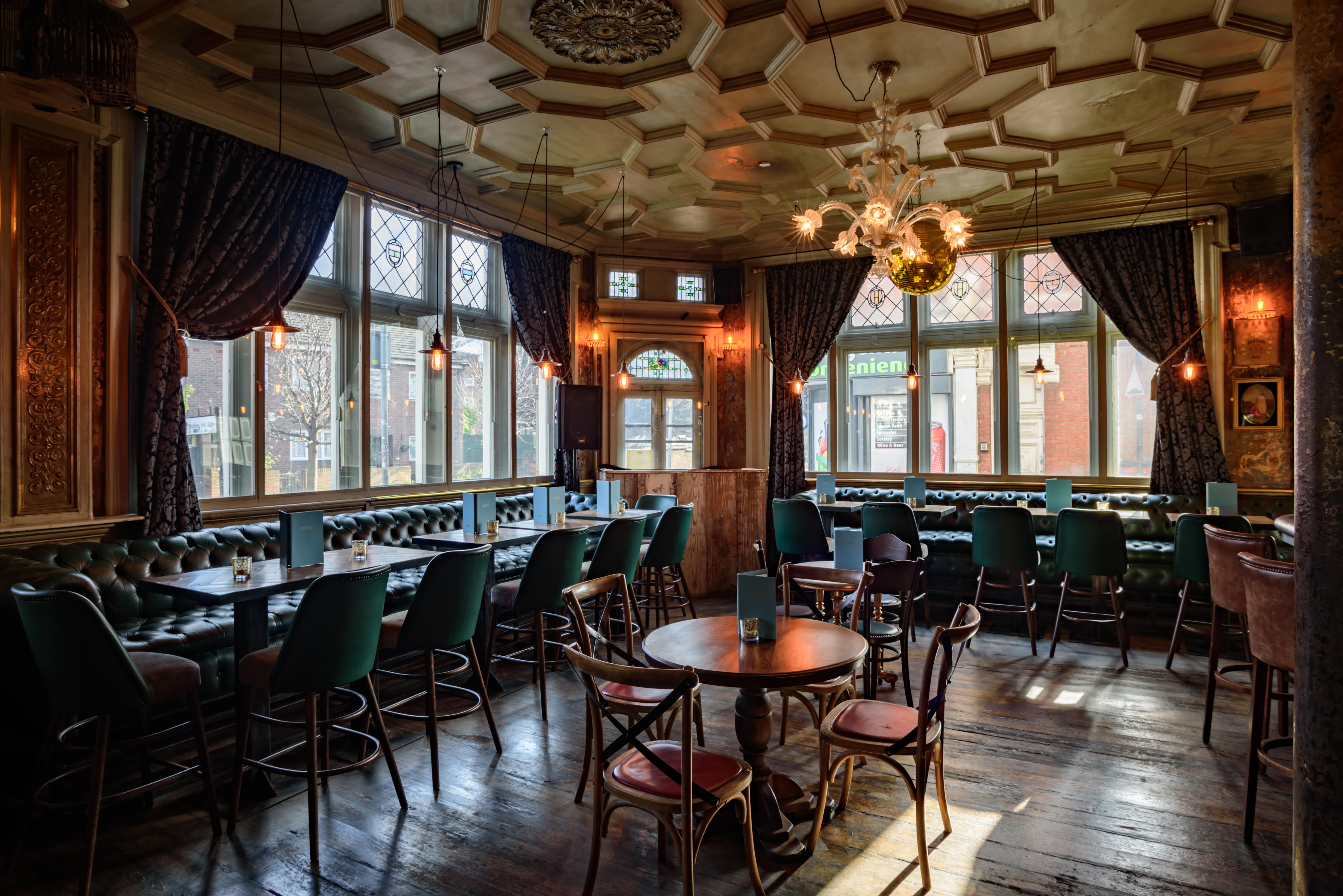 Stylish Kensal Green venue with large windows for networking events and intimate gatherings.