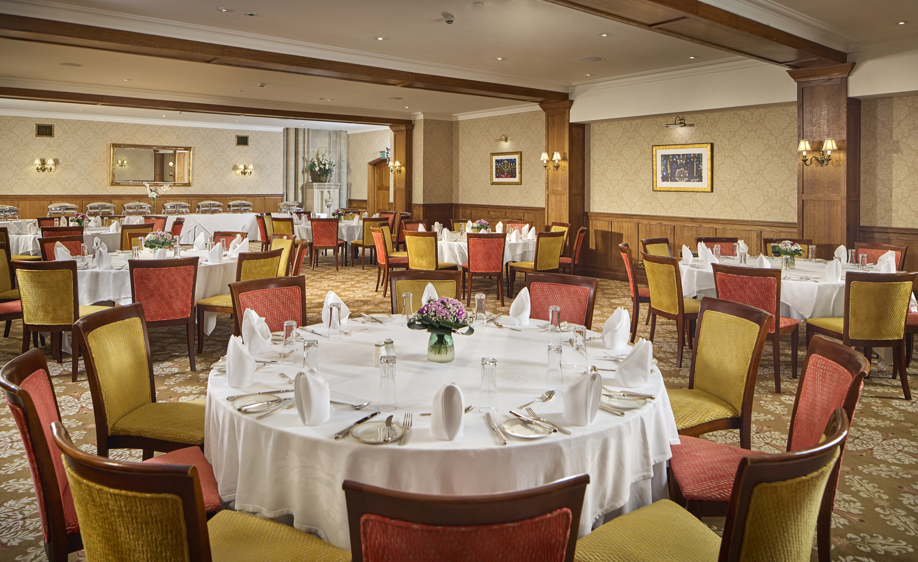 John Haywood at Ashdown Park Hotel, banquet-style setup for corporate events and formal dinners.