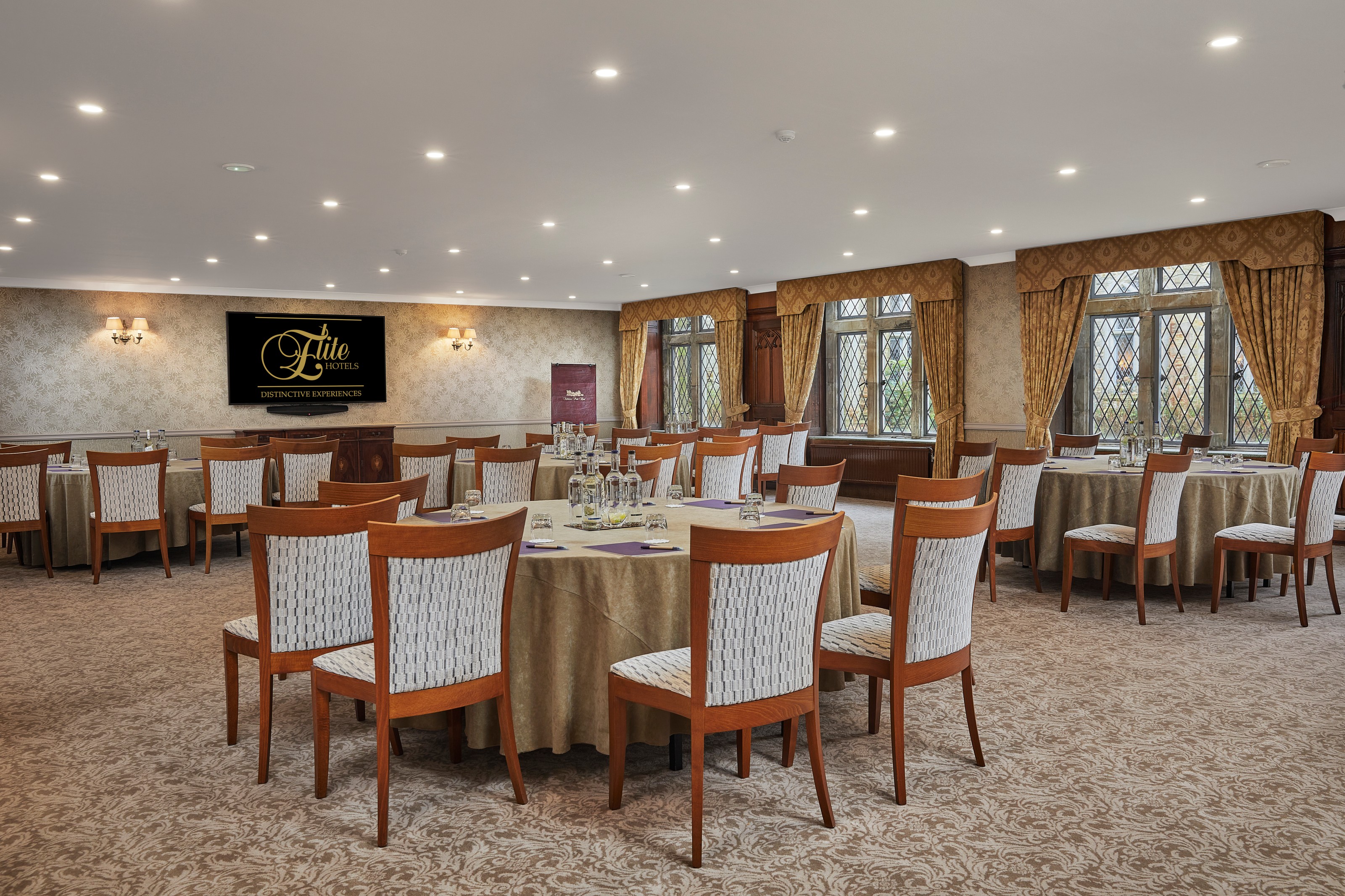Lady Brassey banquet room with round tables for corporate meetings and event conferences.