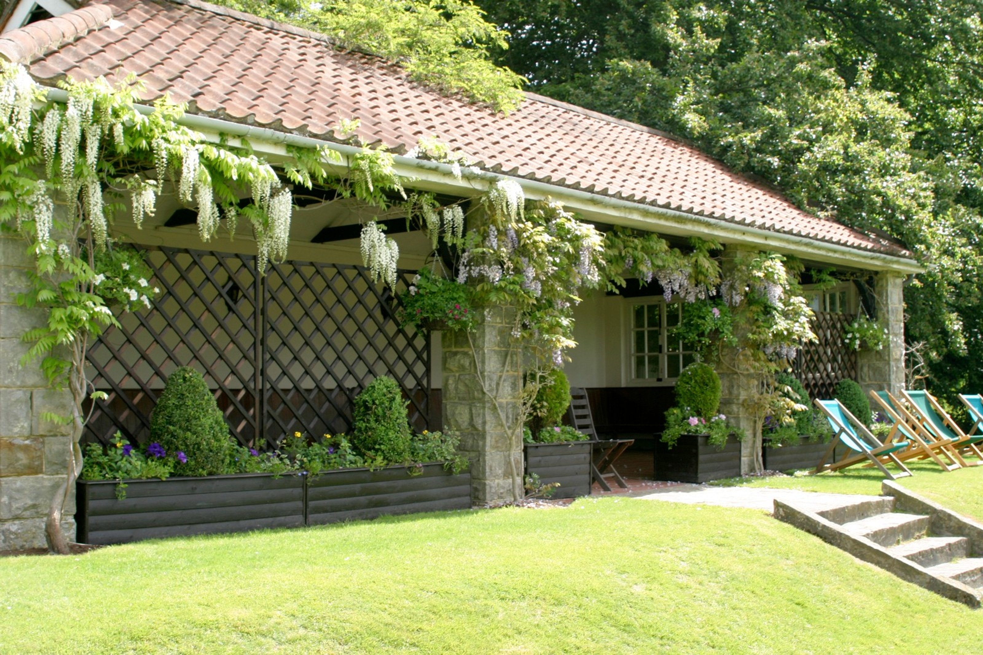 Summerhouse outdoor networking space at Ashdown Park Hotel for rustic garden events.