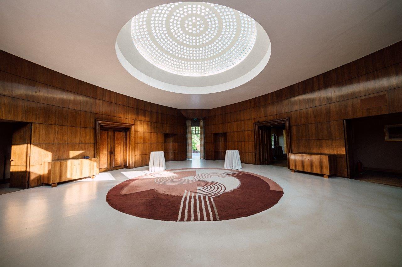 Art Deco Mansion circular event space with oculus for networking receptions and VIP welcome areas. - Banner