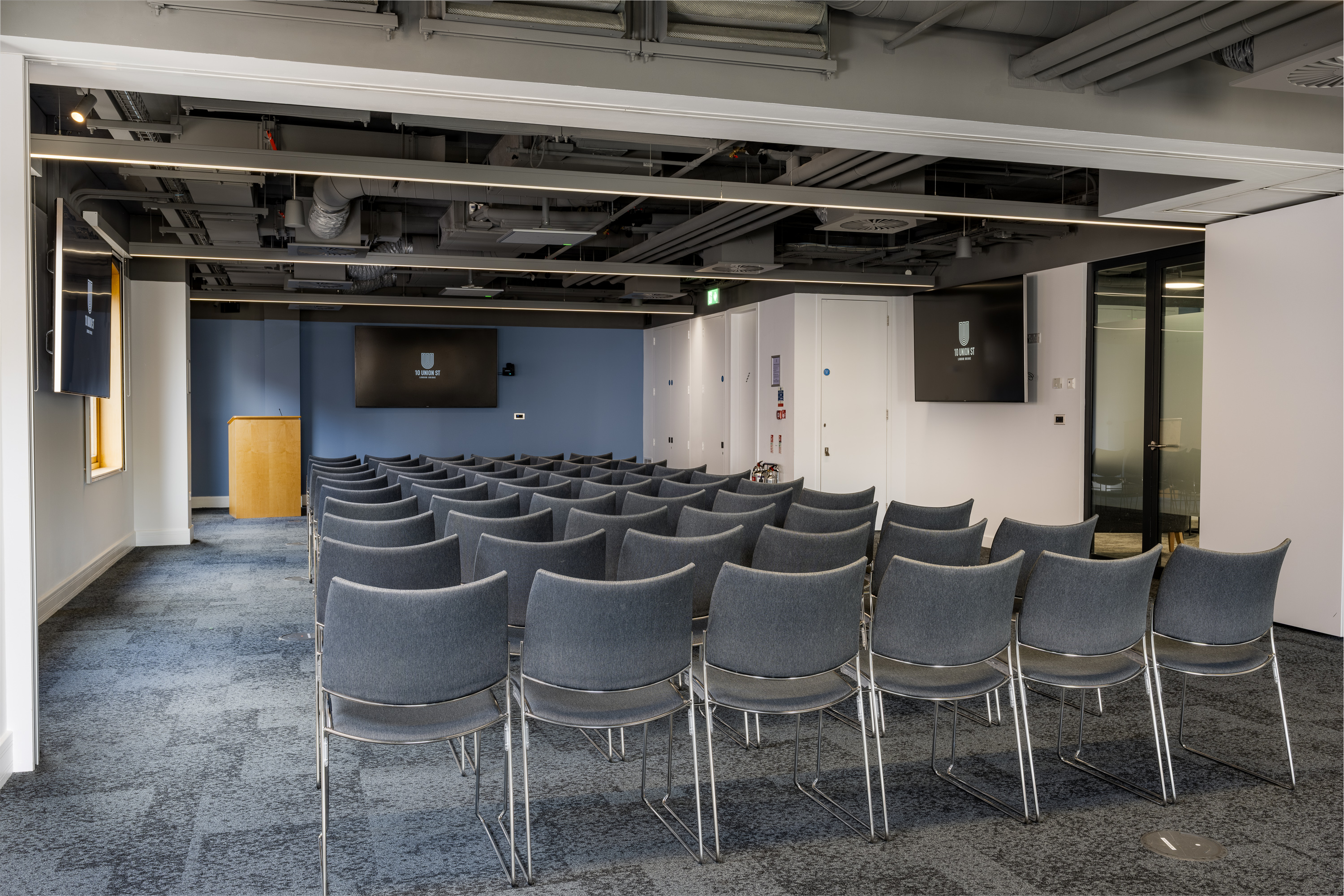 Industrial theater-style conference room for presentations and workshops at 10 Union Street.