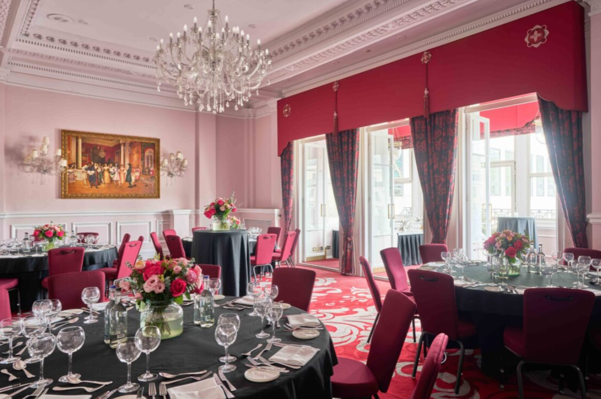 Canterbury banquet hall at The Clermont with red seating for corporate gala or formal dinner.