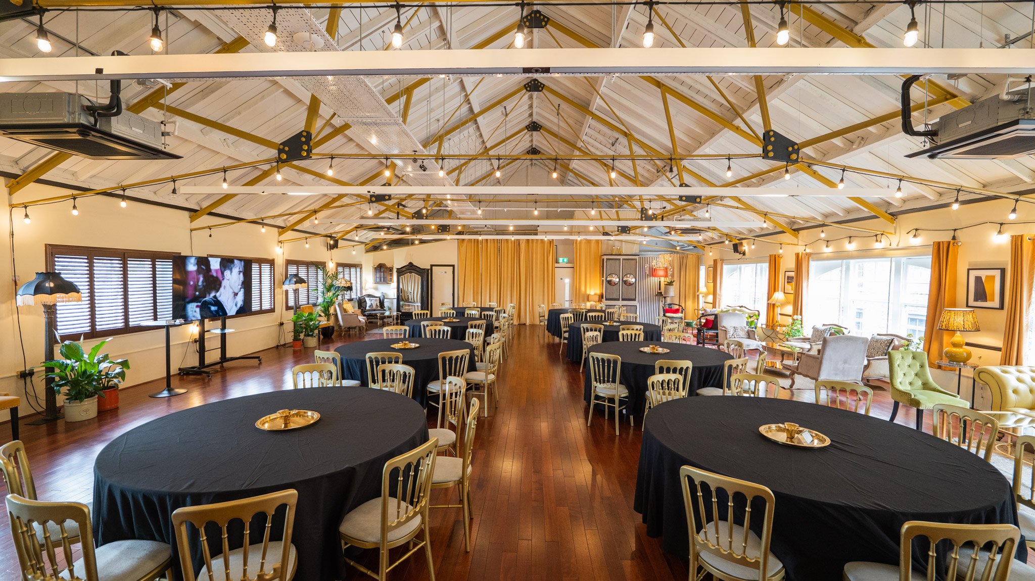 Industrial loft event venue, natural light, conference, reception.