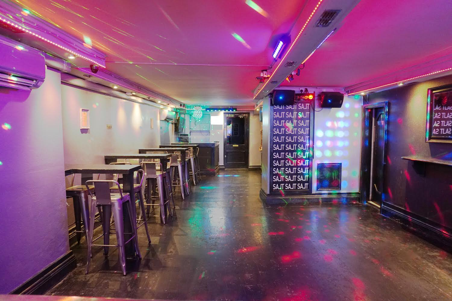 Vibrant event space in West Hampstead with colorful lighting for parties and gatherings. - Banner