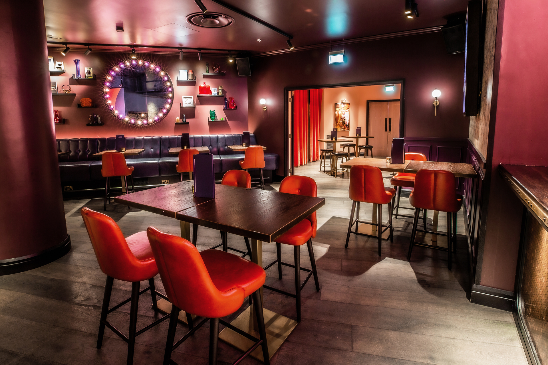 Christmas party at Puttshack with modern decor and vibrant seating for events.