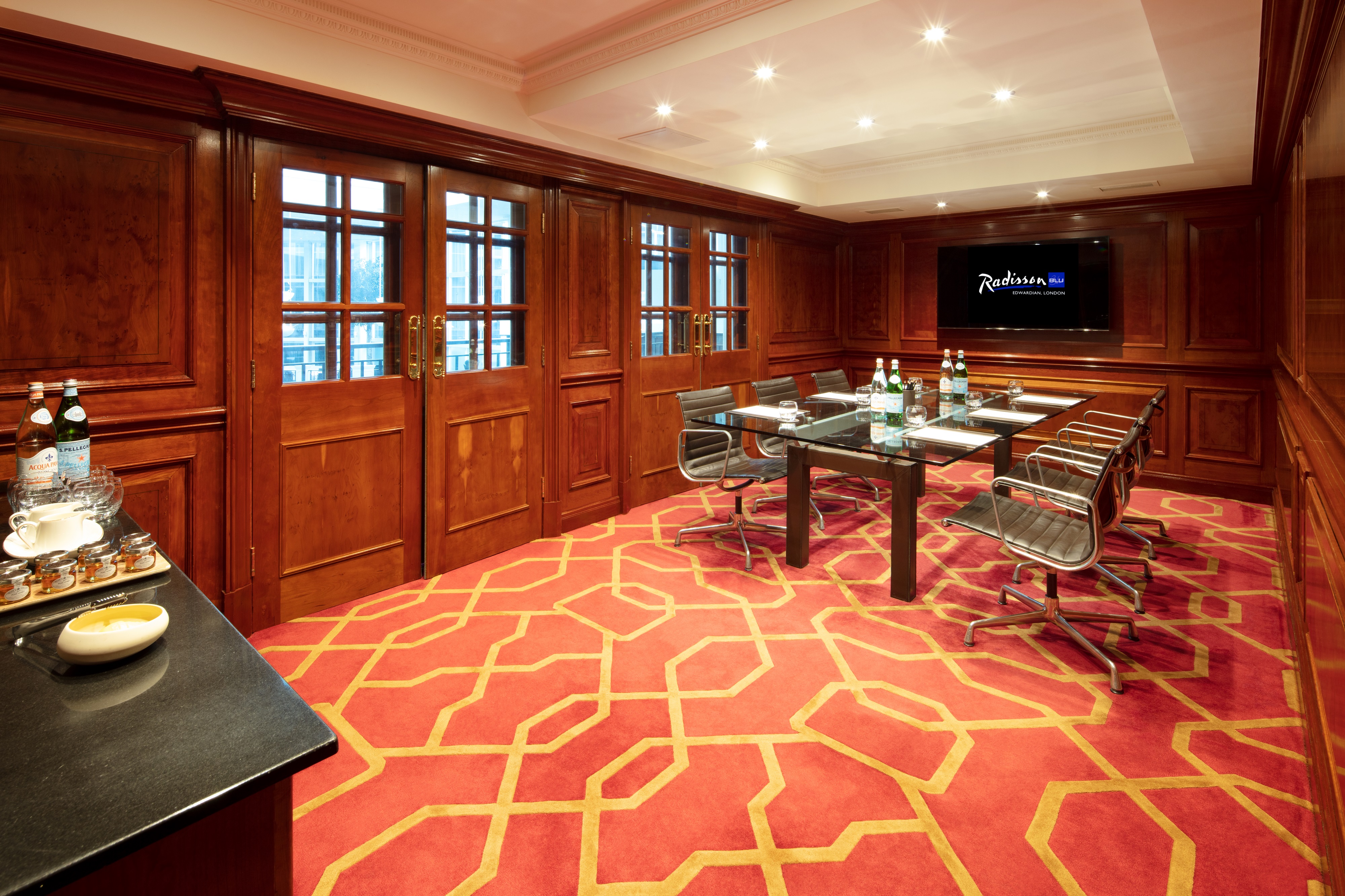 Private Room 30 at Radisson Blu Heathrow: elegant meeting space with wooden paneling.