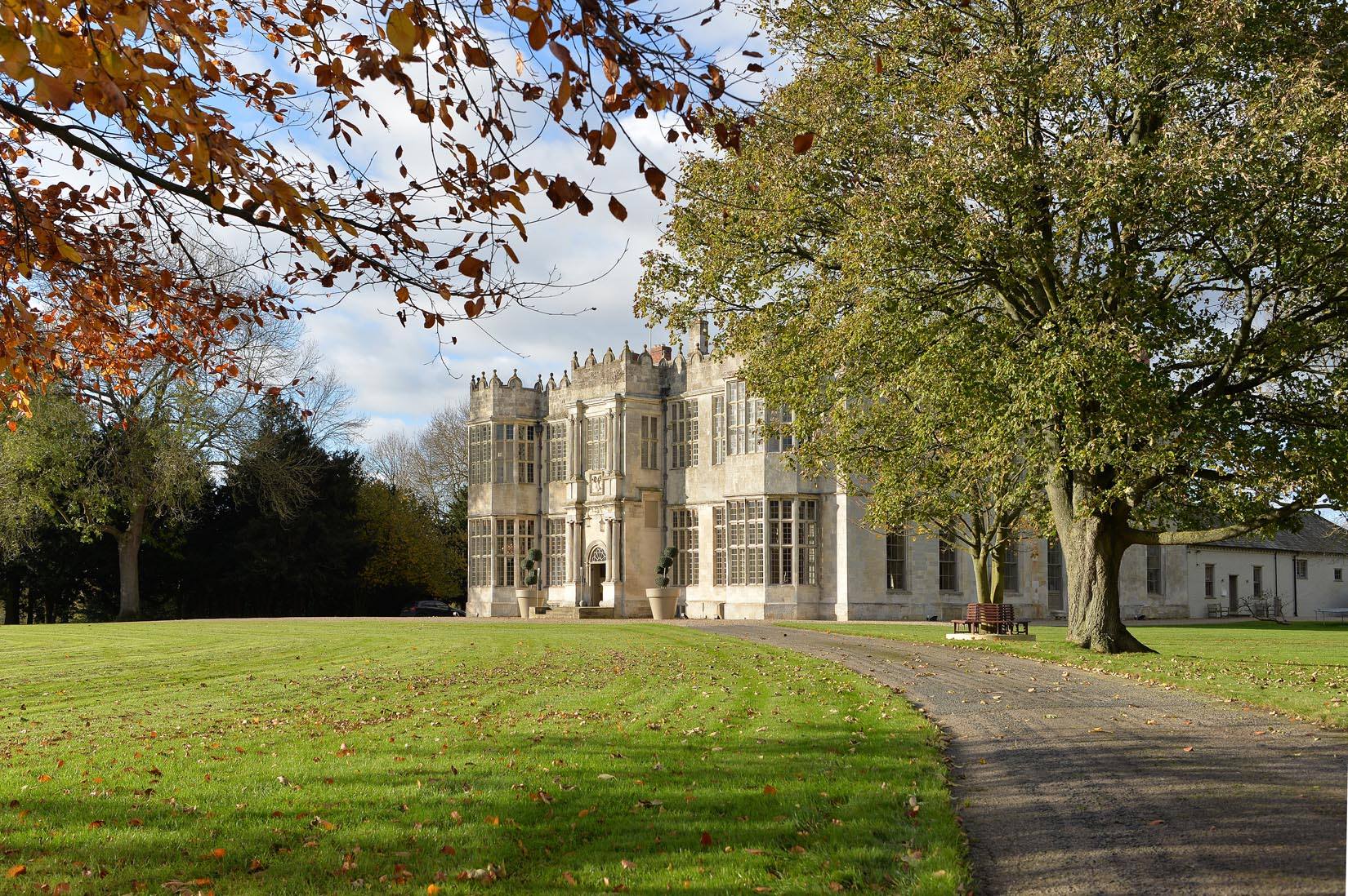 Elegant Howsham Hall venue with lush greenery, ideal for corporate events and weddings.