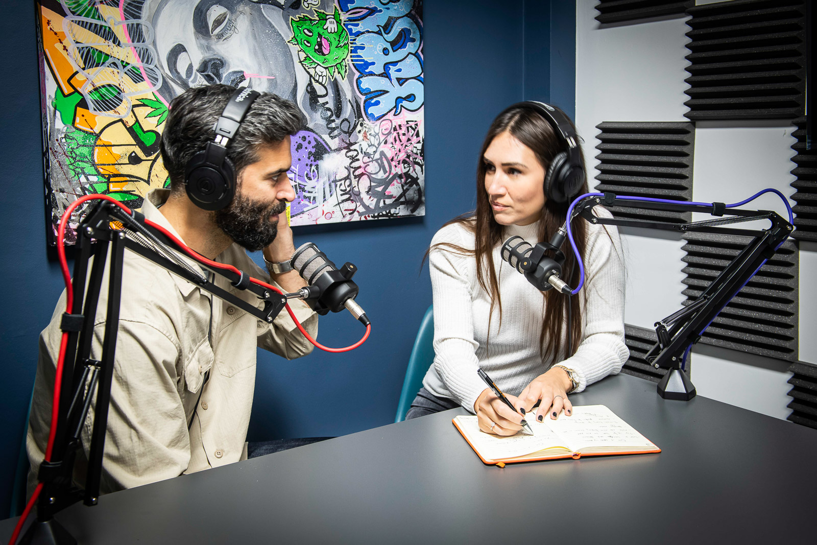 Podcast recording room with professional microphones for engaging discussions and events.