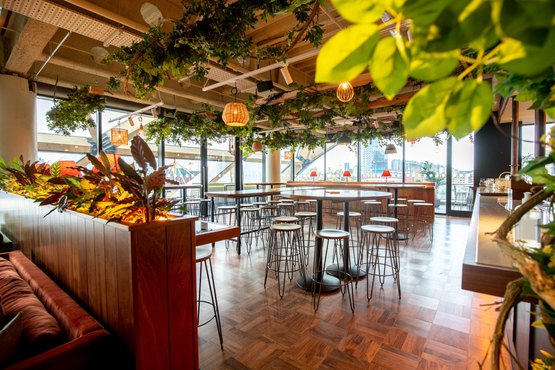 Stylish event space in Pergola on the Wharf with modern design and greenery.