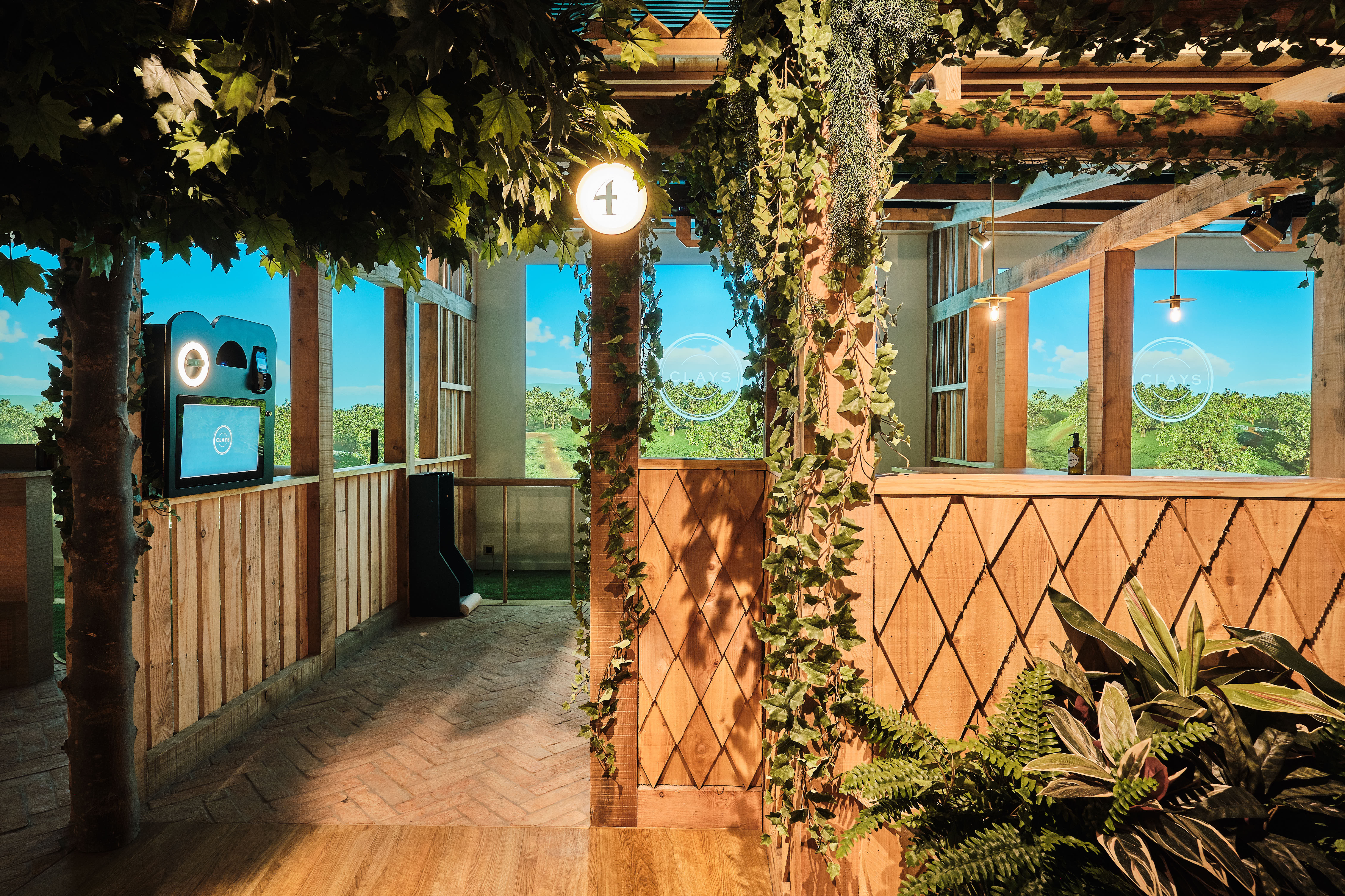 Modern event space with greenery and natural light for networking and meetings.