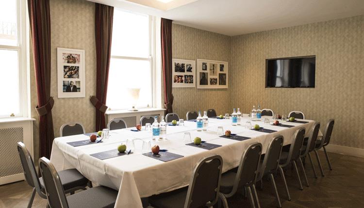 Boardroom meeting room at The Snug Brighton, ideal for professional corporate events and workshops.