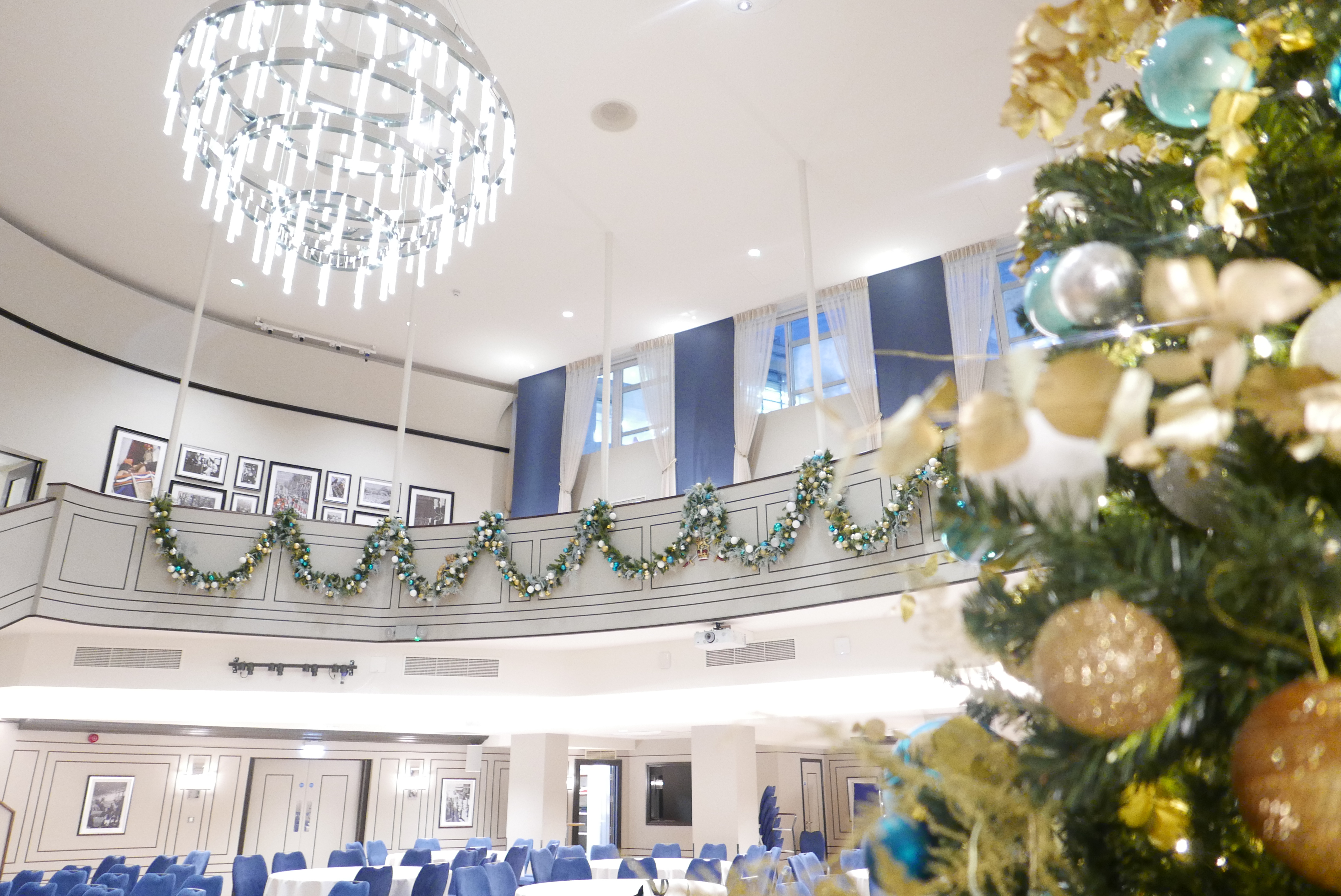 Elegant Christmas party at Carisbrooke Hall, featuring grand chandelier for corporate gala events.