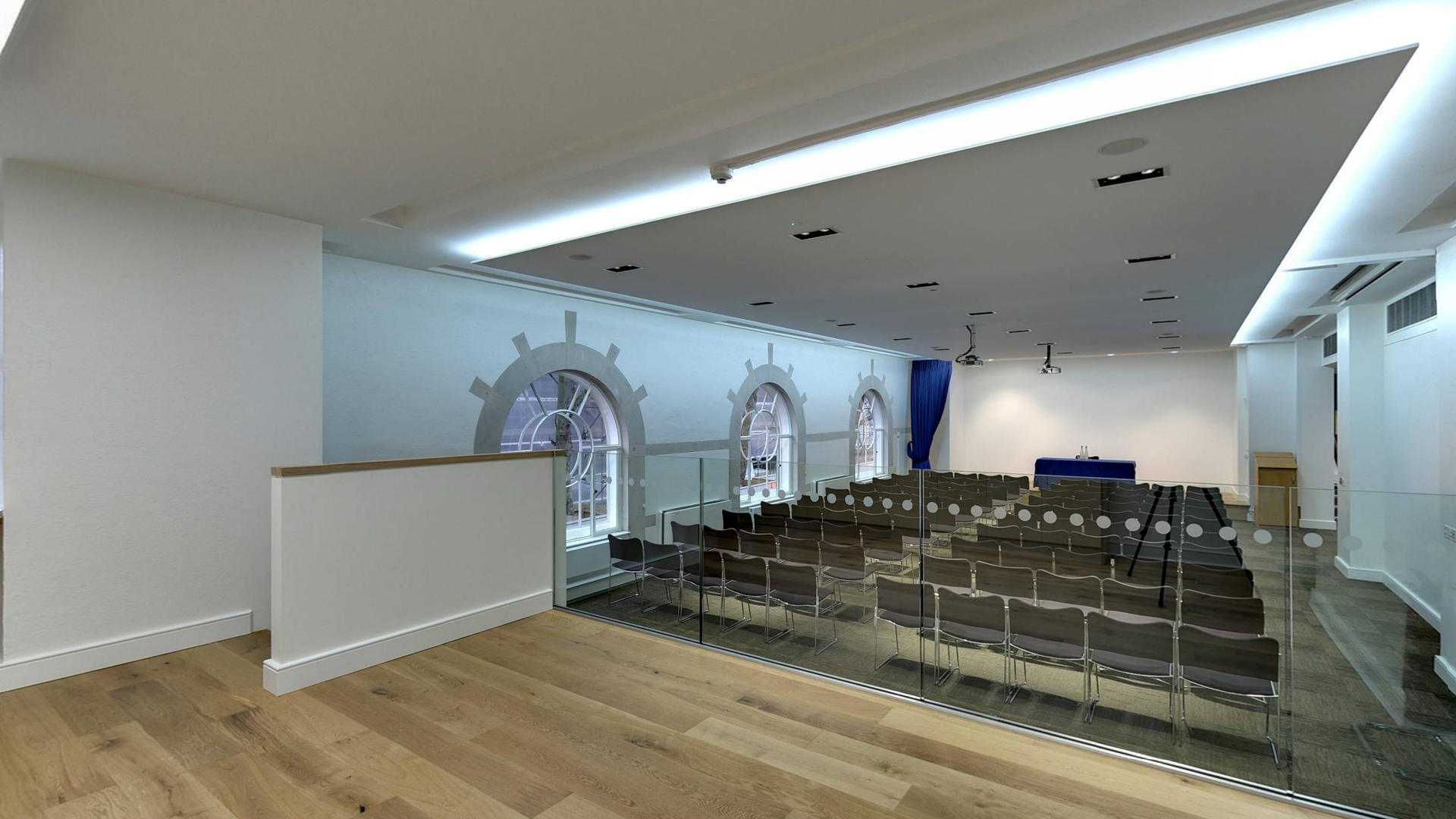 Modern event space with natural light, ideal for corporate meetings and workshops.