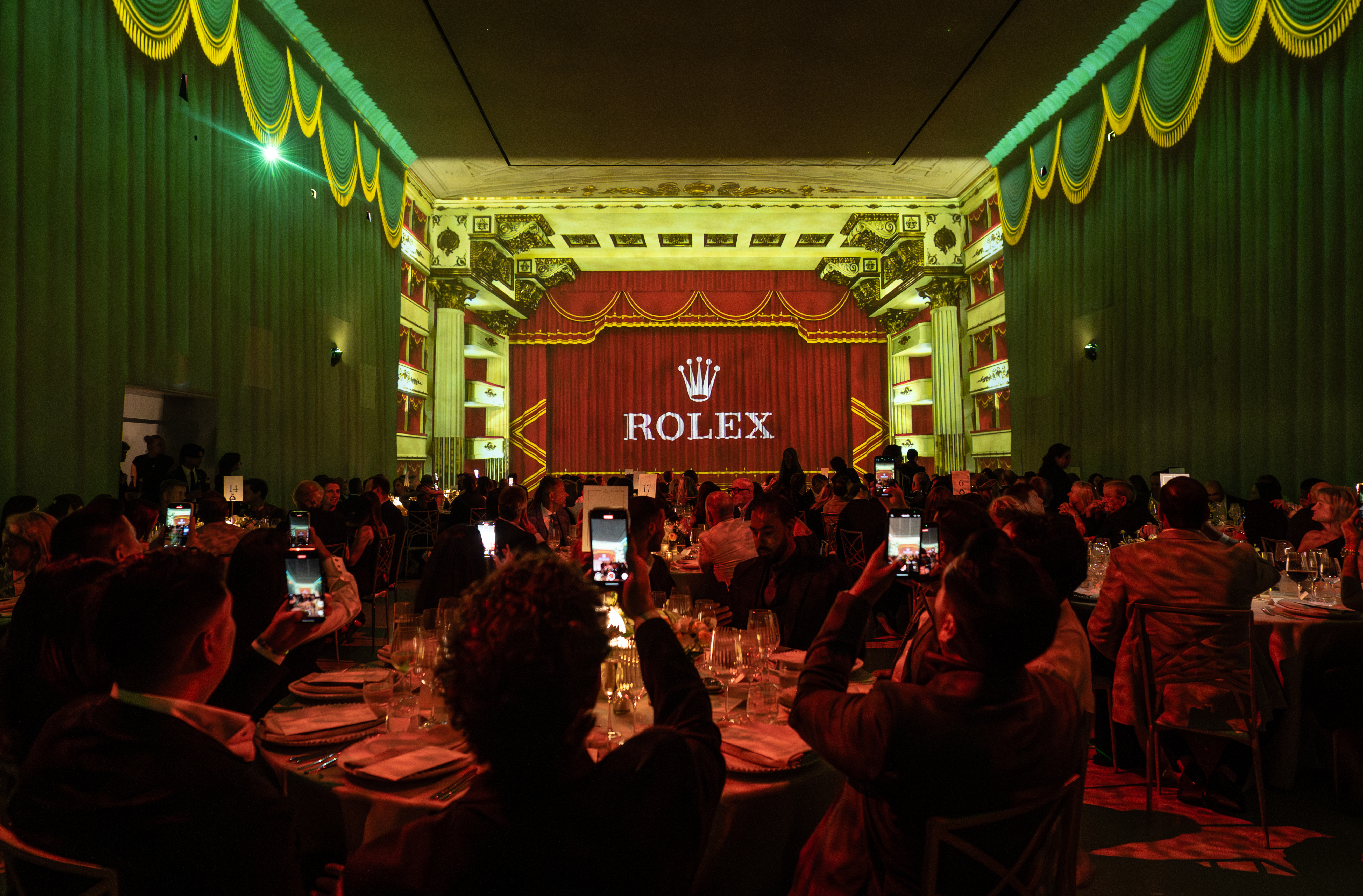 Rolex gala event, green lighting, luxury product launch