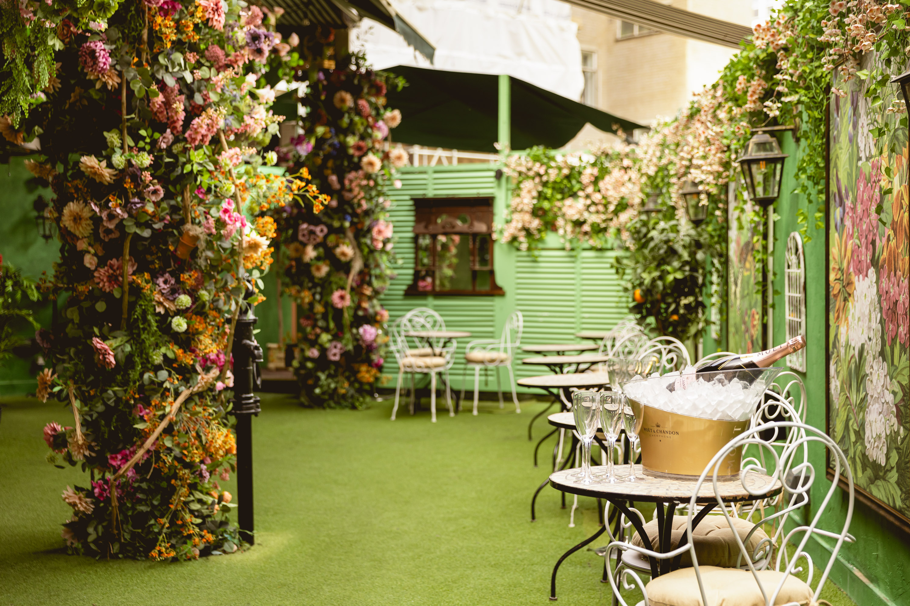 Mr Fogg's Secret Garden venue with lush flowers, perfect for upscale garden parties. - Banner