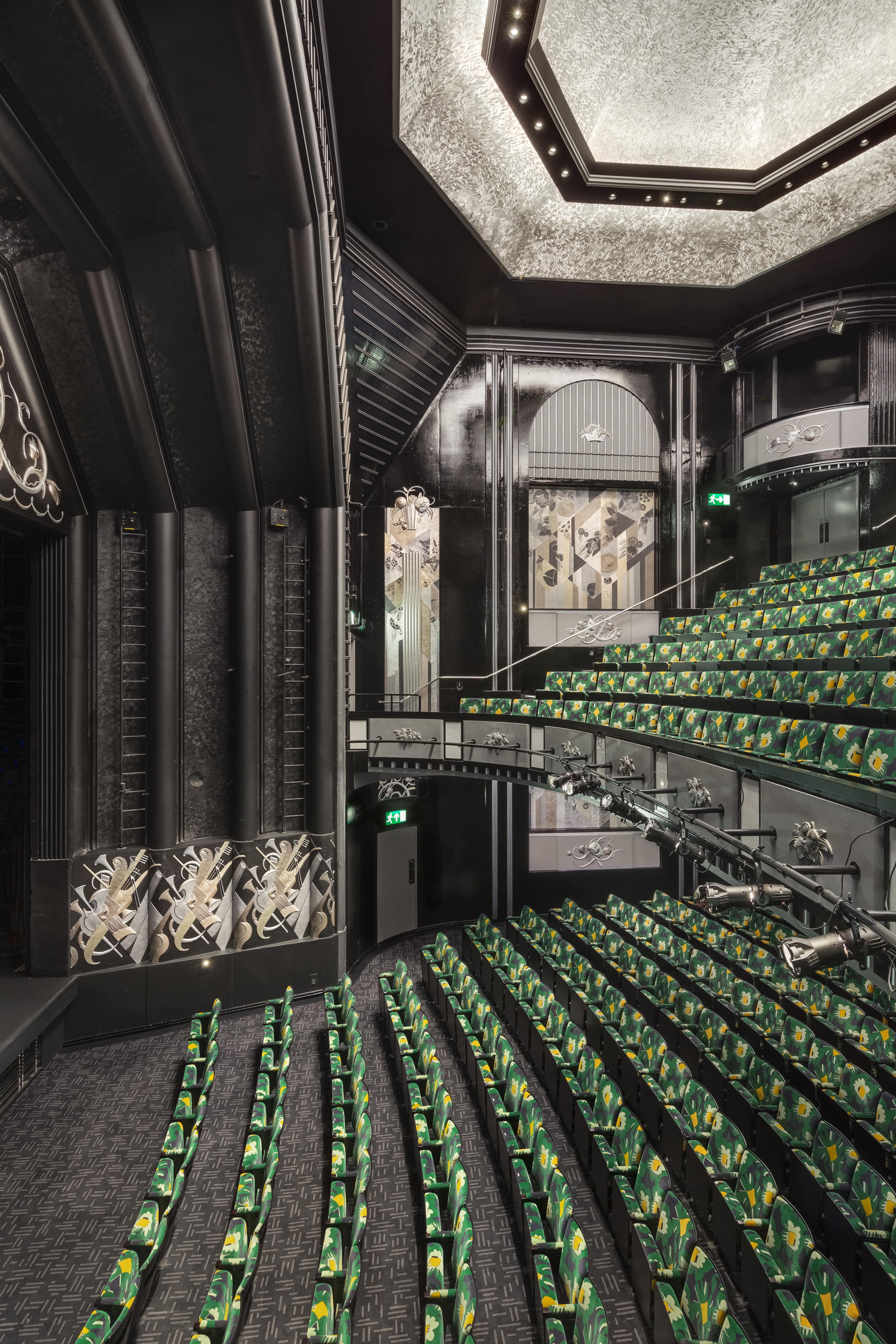 Modern auditorium in Trafalgar Theatre with tiered seating for events and performances. - Banner