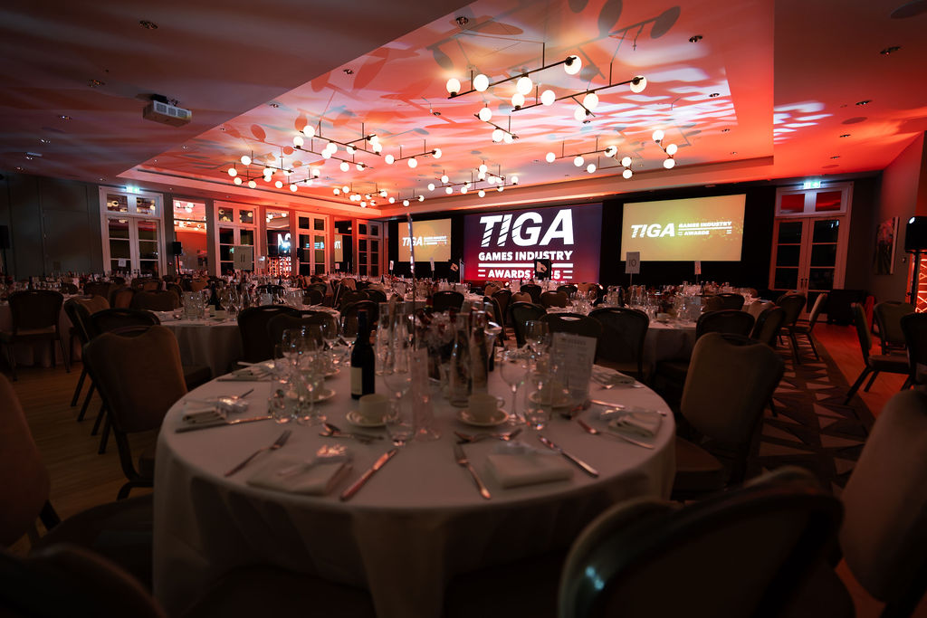 Gala dinner setup at The Hurlingham Club with stage lighting for industry awards ceremony.
