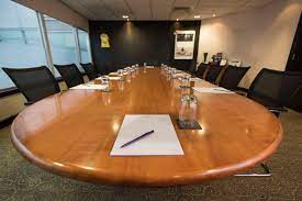 Pembroke Suite conference room with oval table, ideal for meetings in Cardiff. - Banner