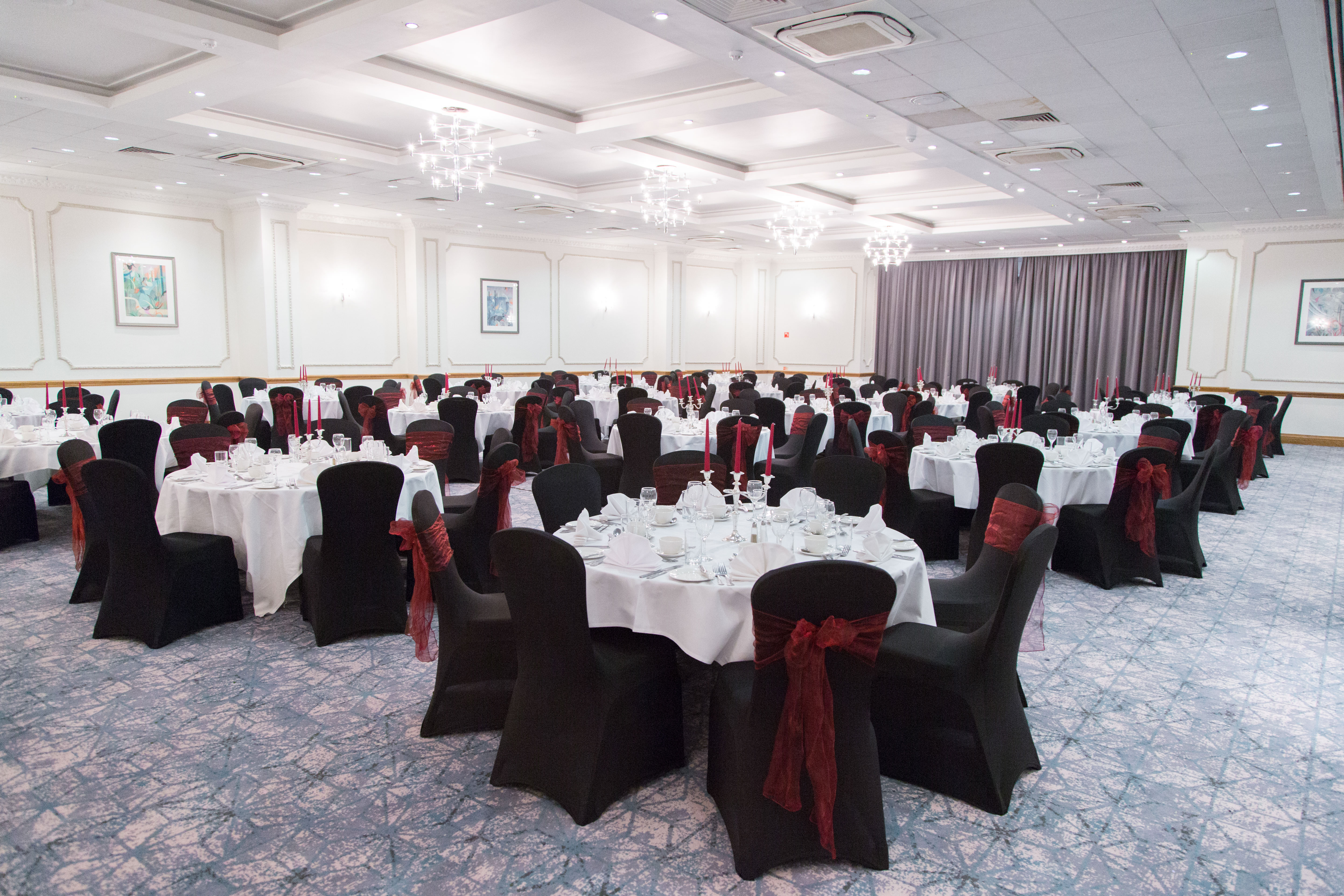 Wessex Suite banquet hall with elegant tables, perfect for corporate events and formal dinners.