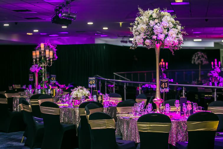 Elegant conference suite with floral centerpieces, perfect for formal events and celebrations. - Banner