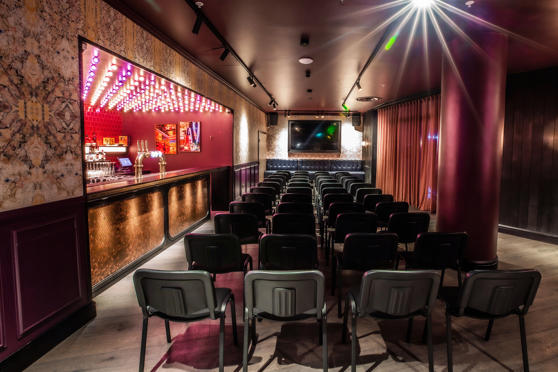 Stylish event space at Puttshack Bank, ideal for networking and small conferences.